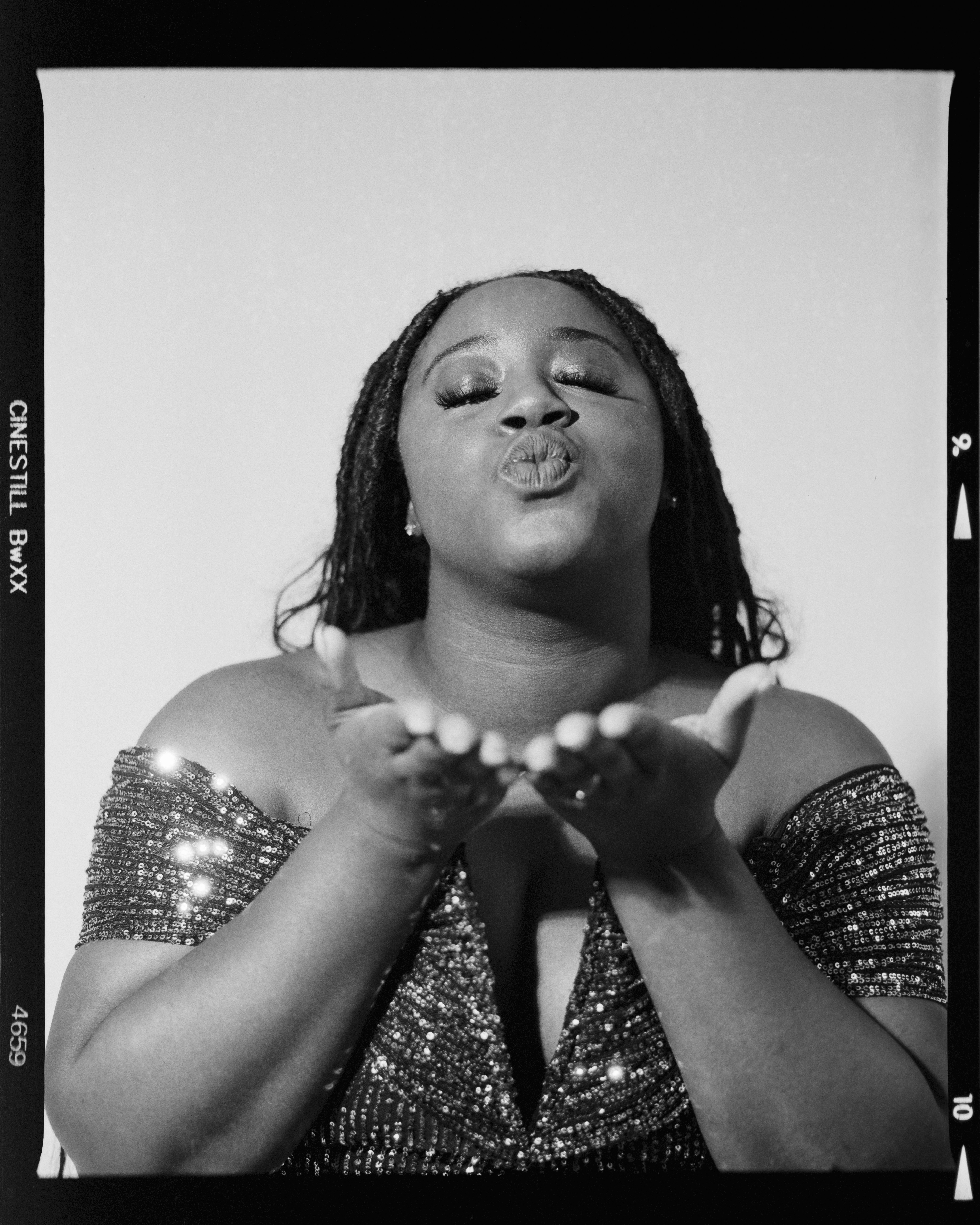 Woman blowing a kiss with hands outstretched