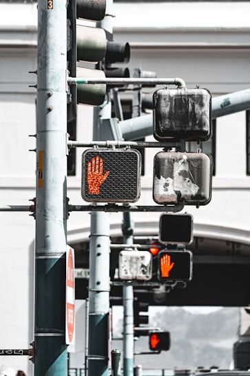 Traffic lights showing a red hand signal
