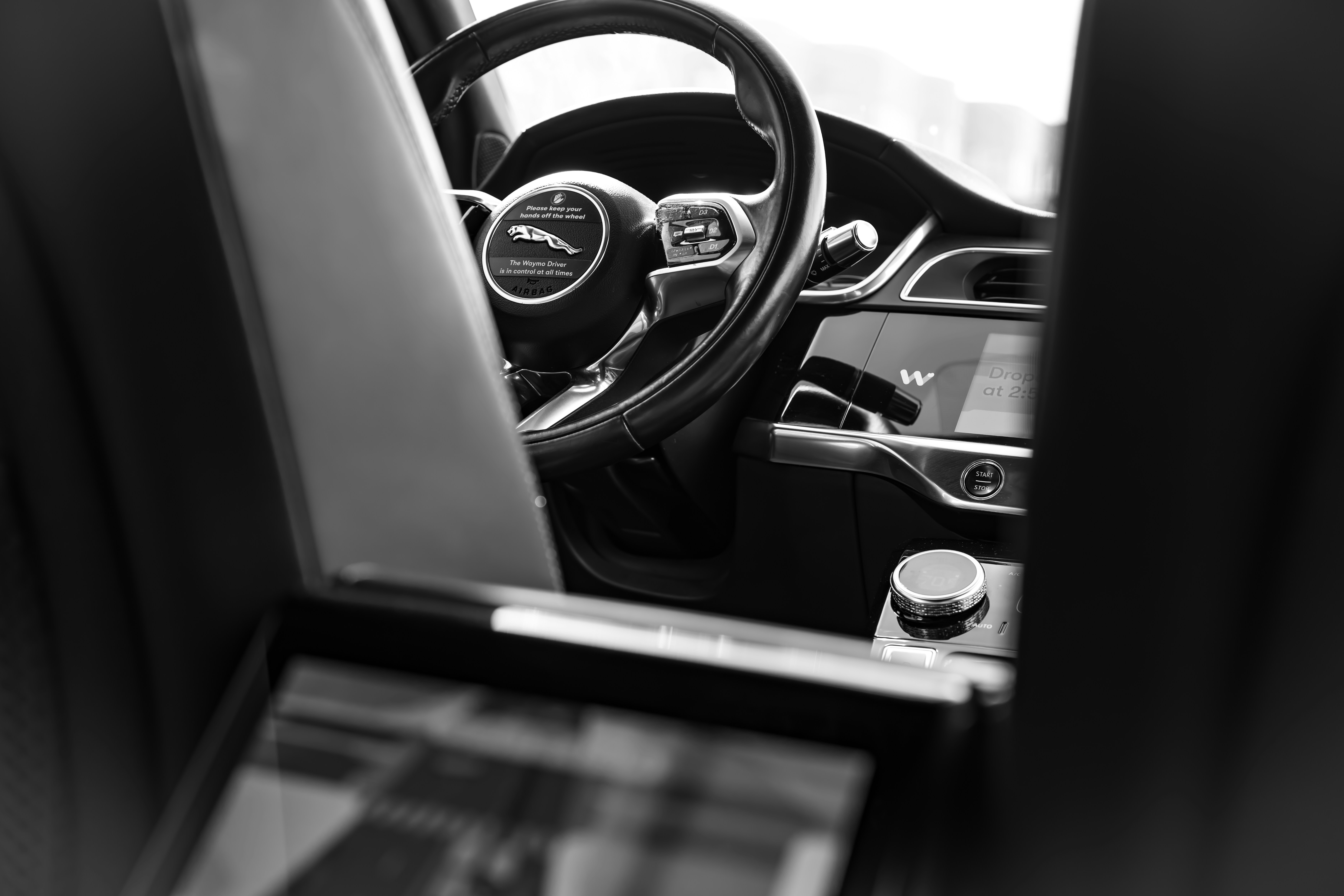 Interior view of a modern car dashboard and steering wheel