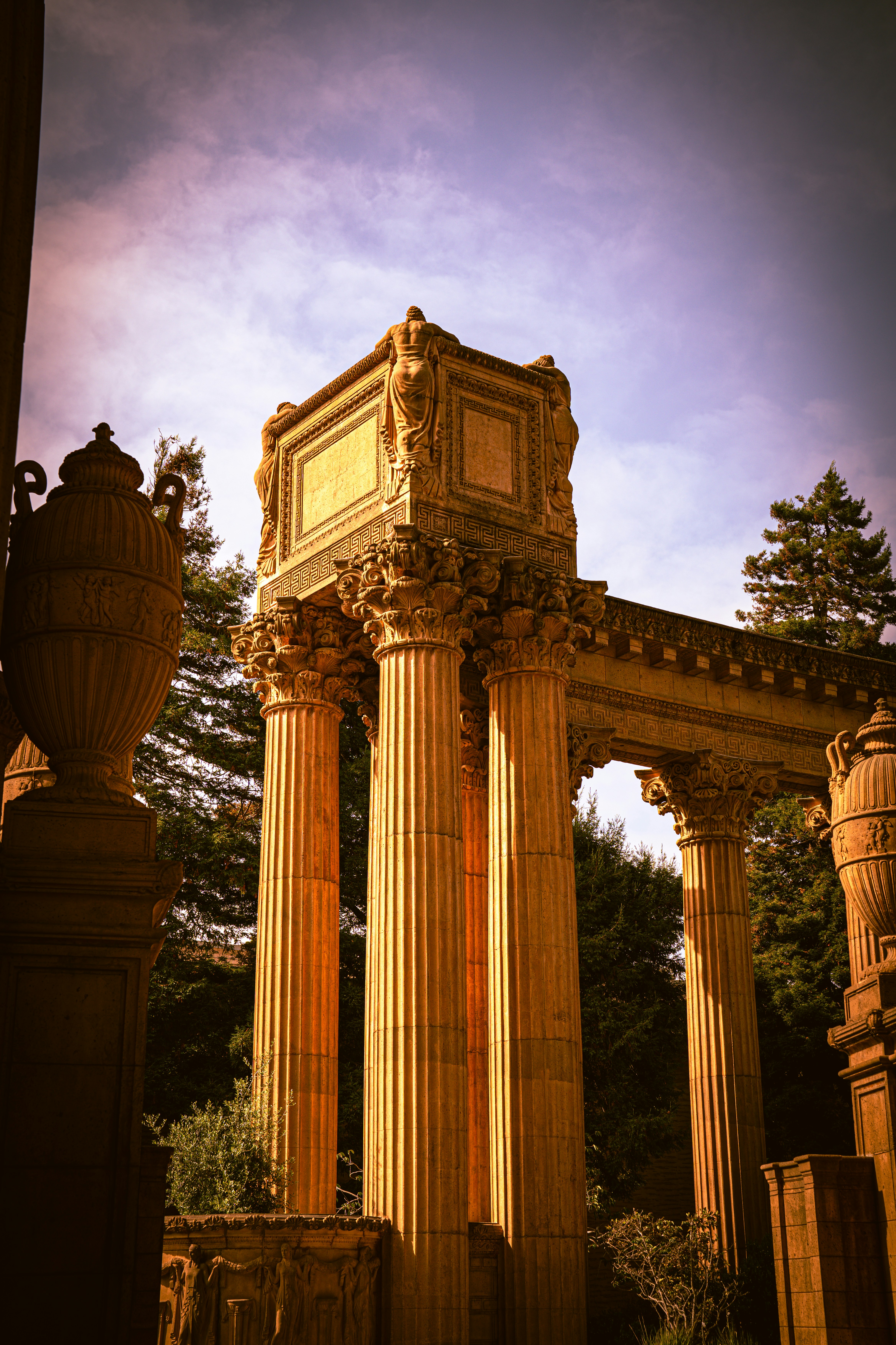Ornate classical architecture with tall columns and urns.