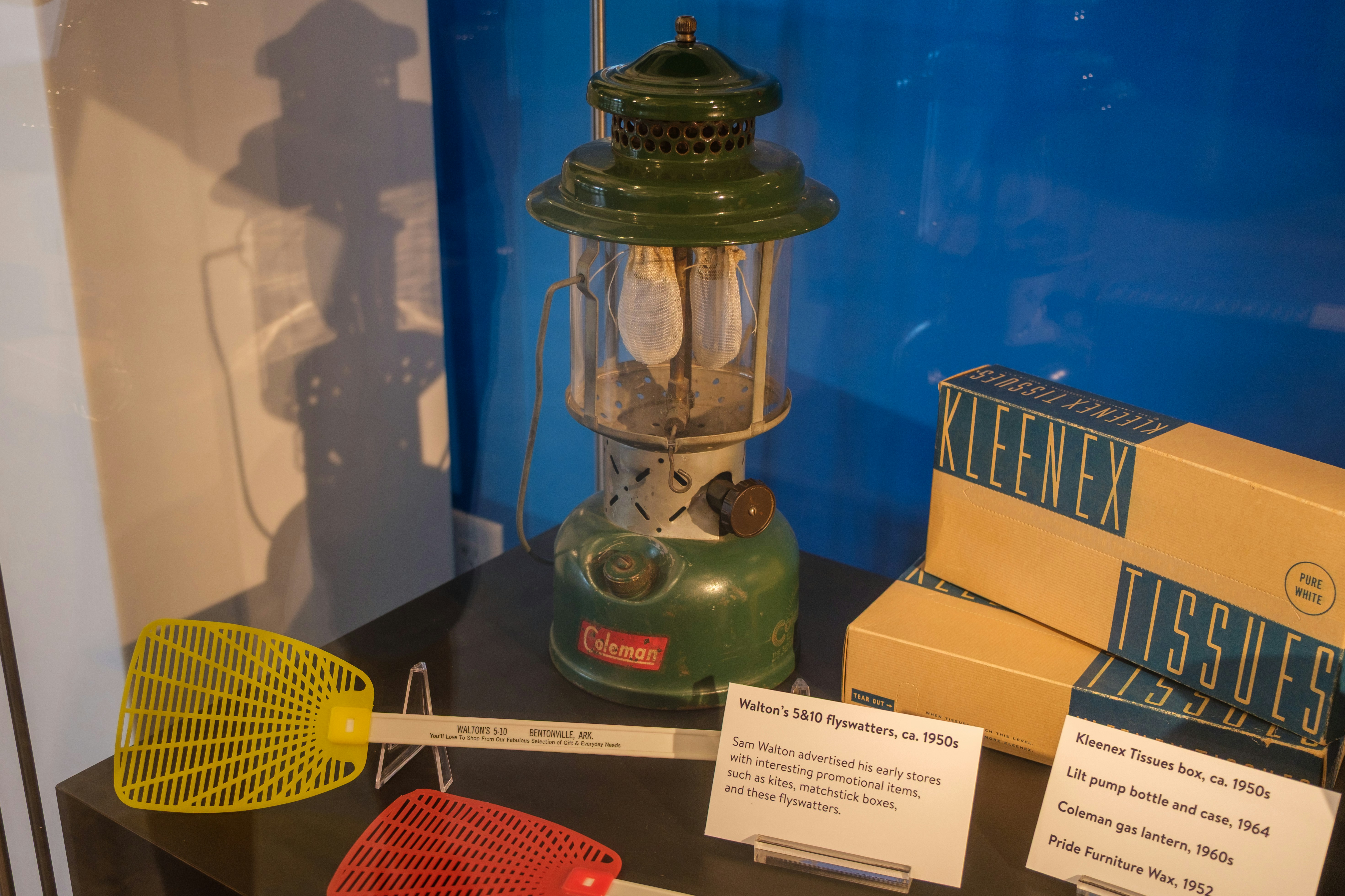 Vintage coleman lantern and kleenex boxes displayed