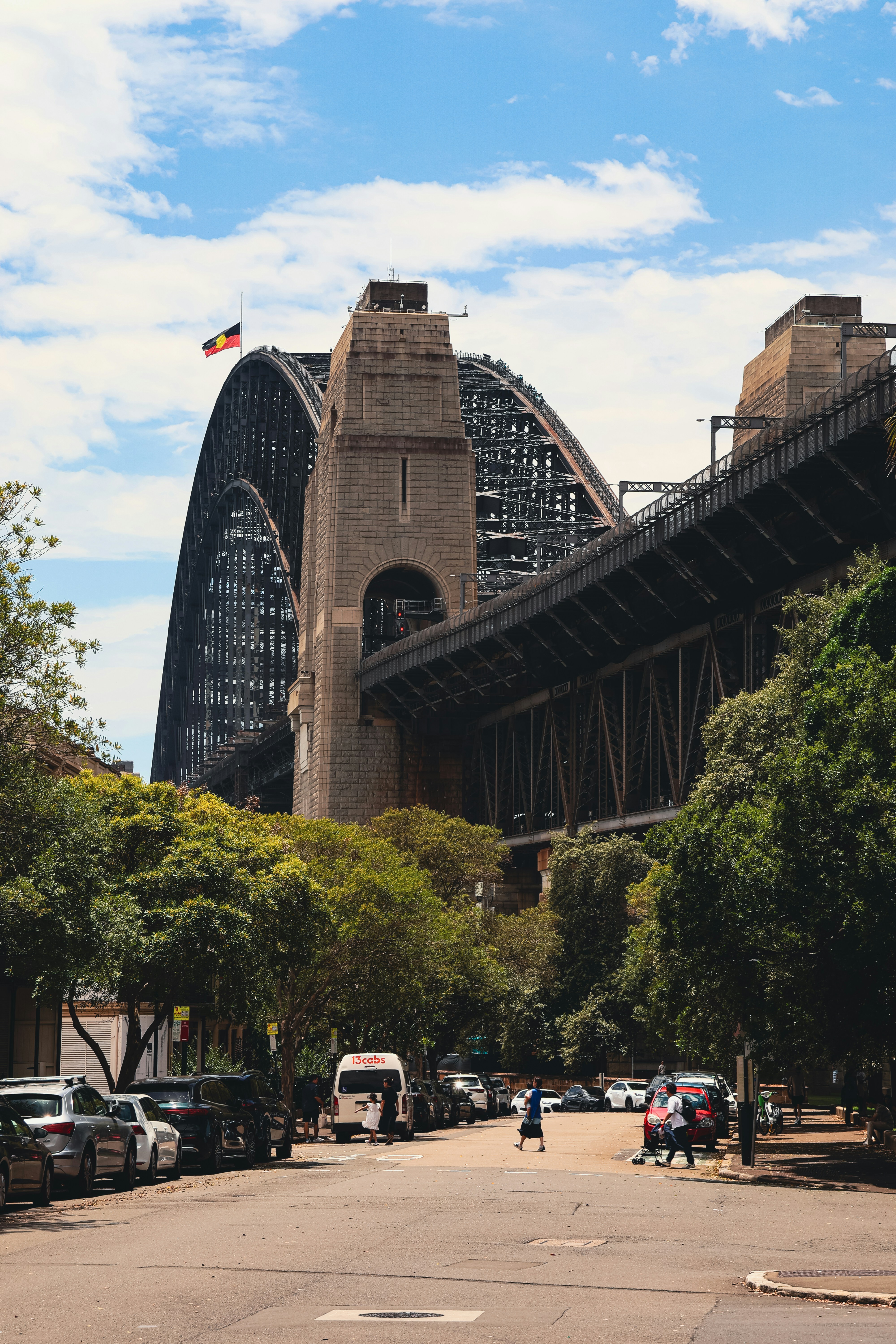 Sydney harbour bridge with trees and street below