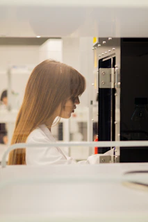 Scientist in lab coat working in laboratory