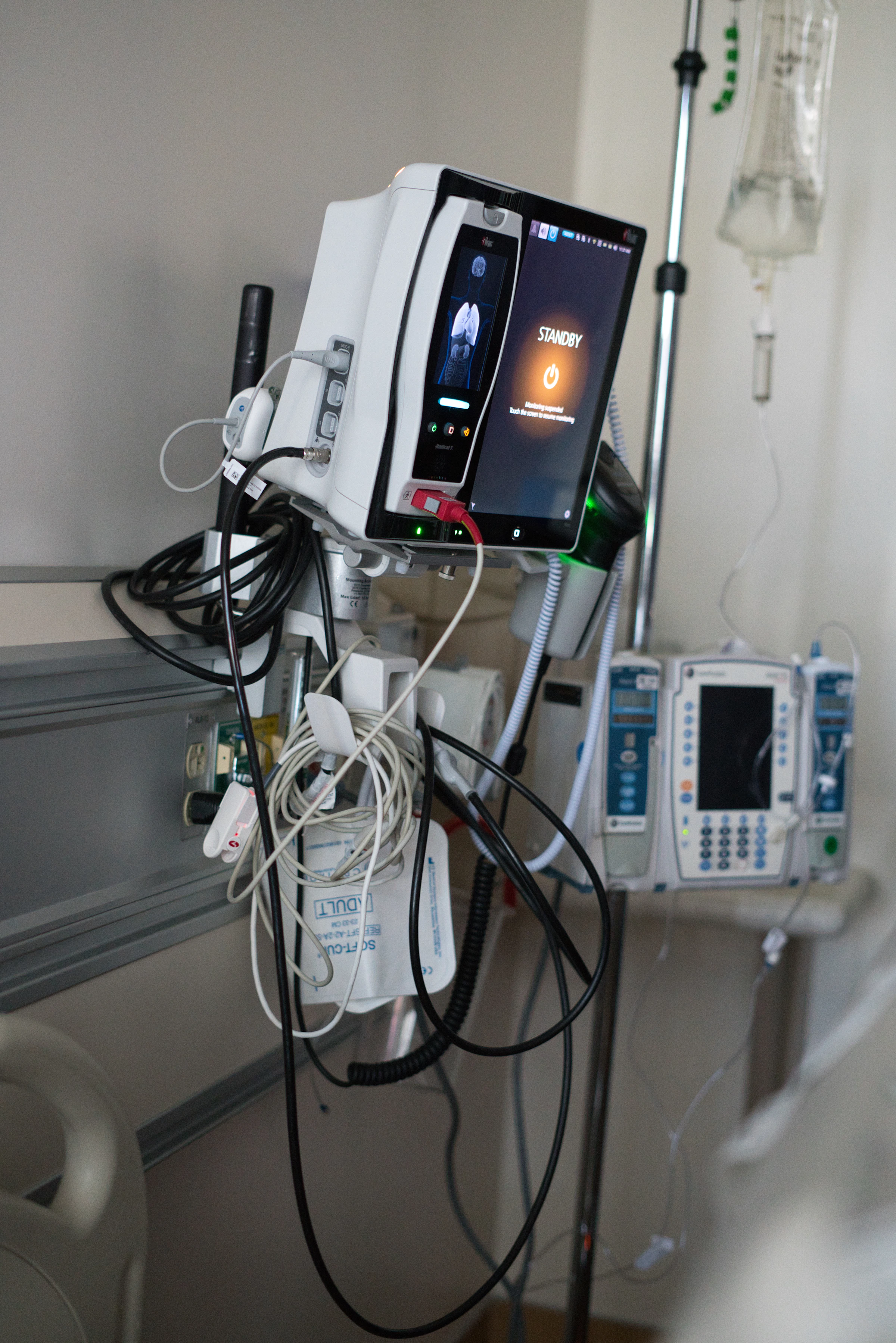 Advanced medical equipment operating inside a modern hospital room