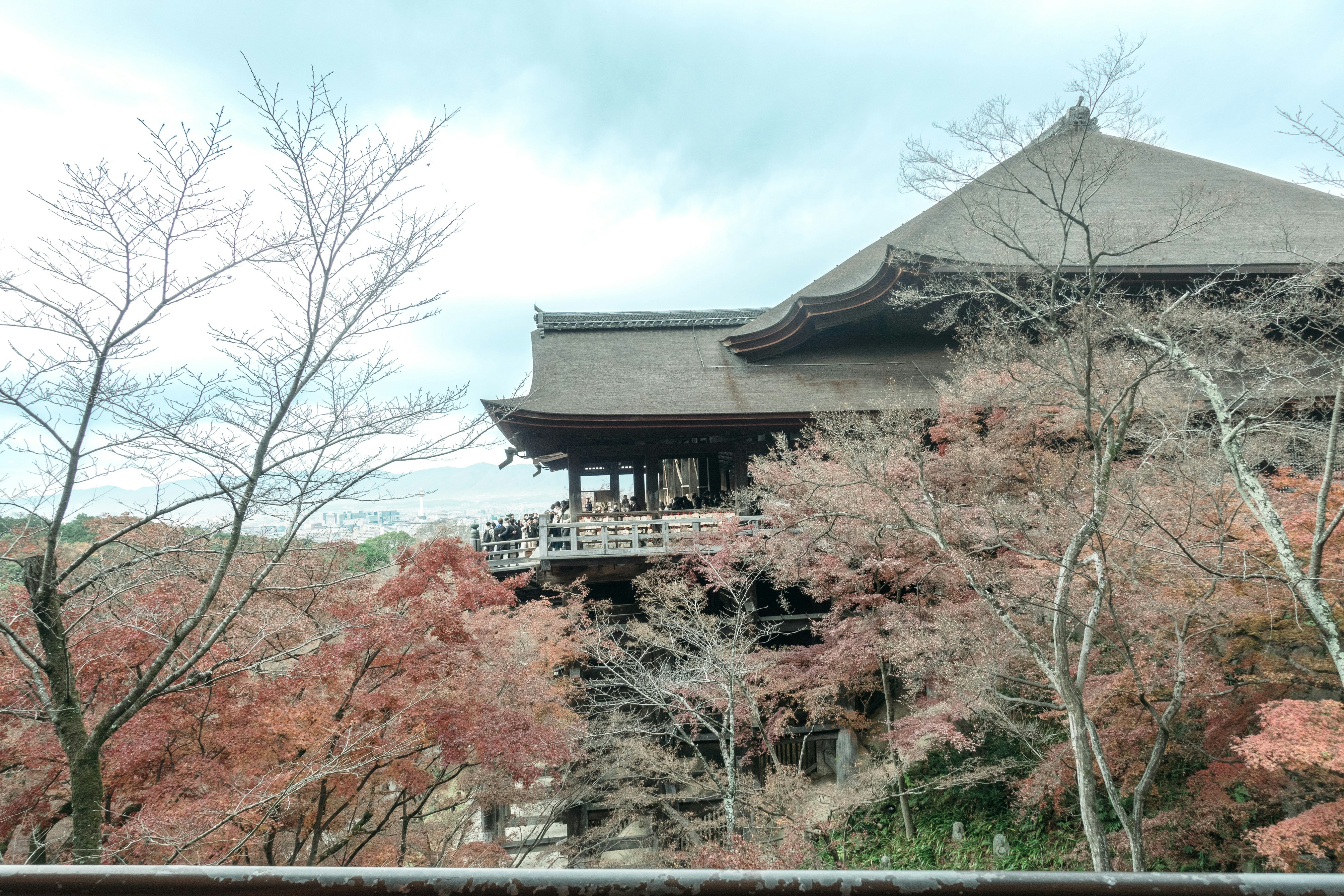 Traditional japanese temple surrounded by autumn foliage