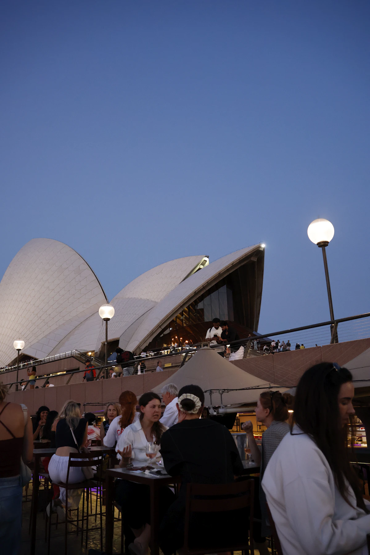 Sydney Opera House and people enjoying the waterfront