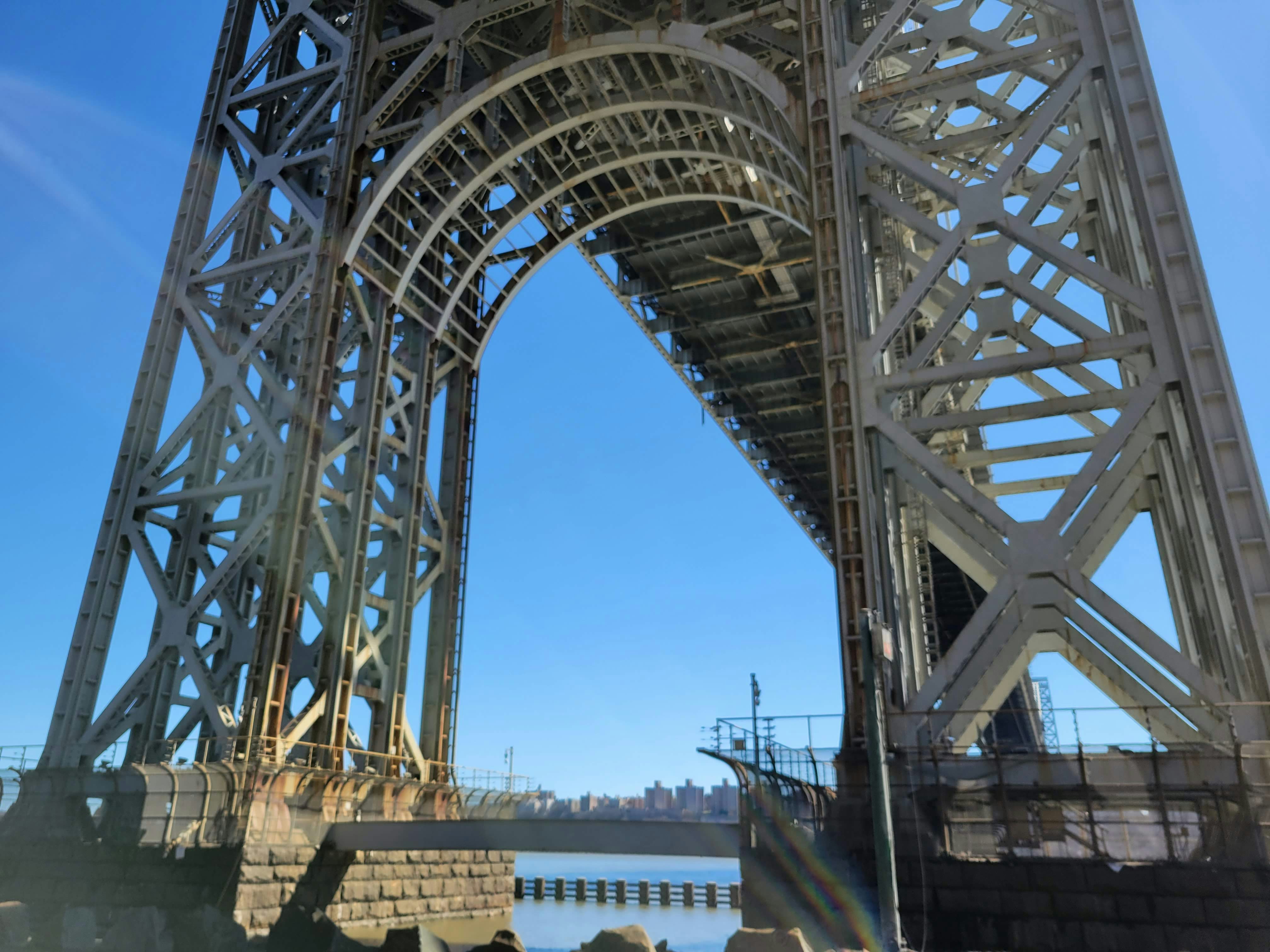 Underside view of a large steel bridge structure