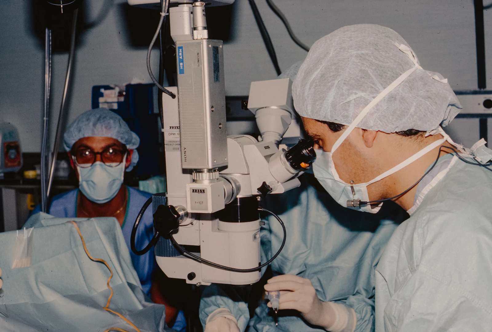 Surgeons operating using a surgical microscope