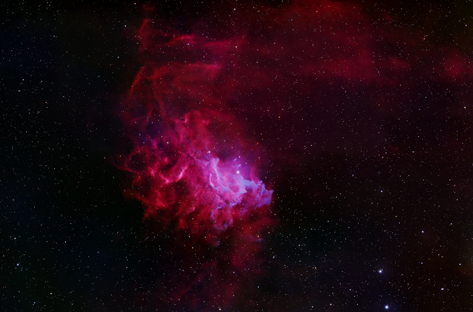 Vibrant swirls of colors resembling a cosmic aurora or nebula, evoking a sense of mystery and possibility.