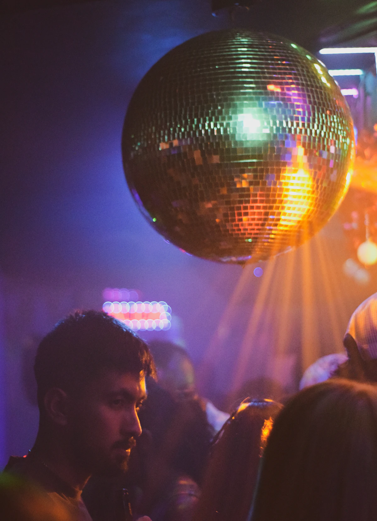 Dancers beneath a mirror ball