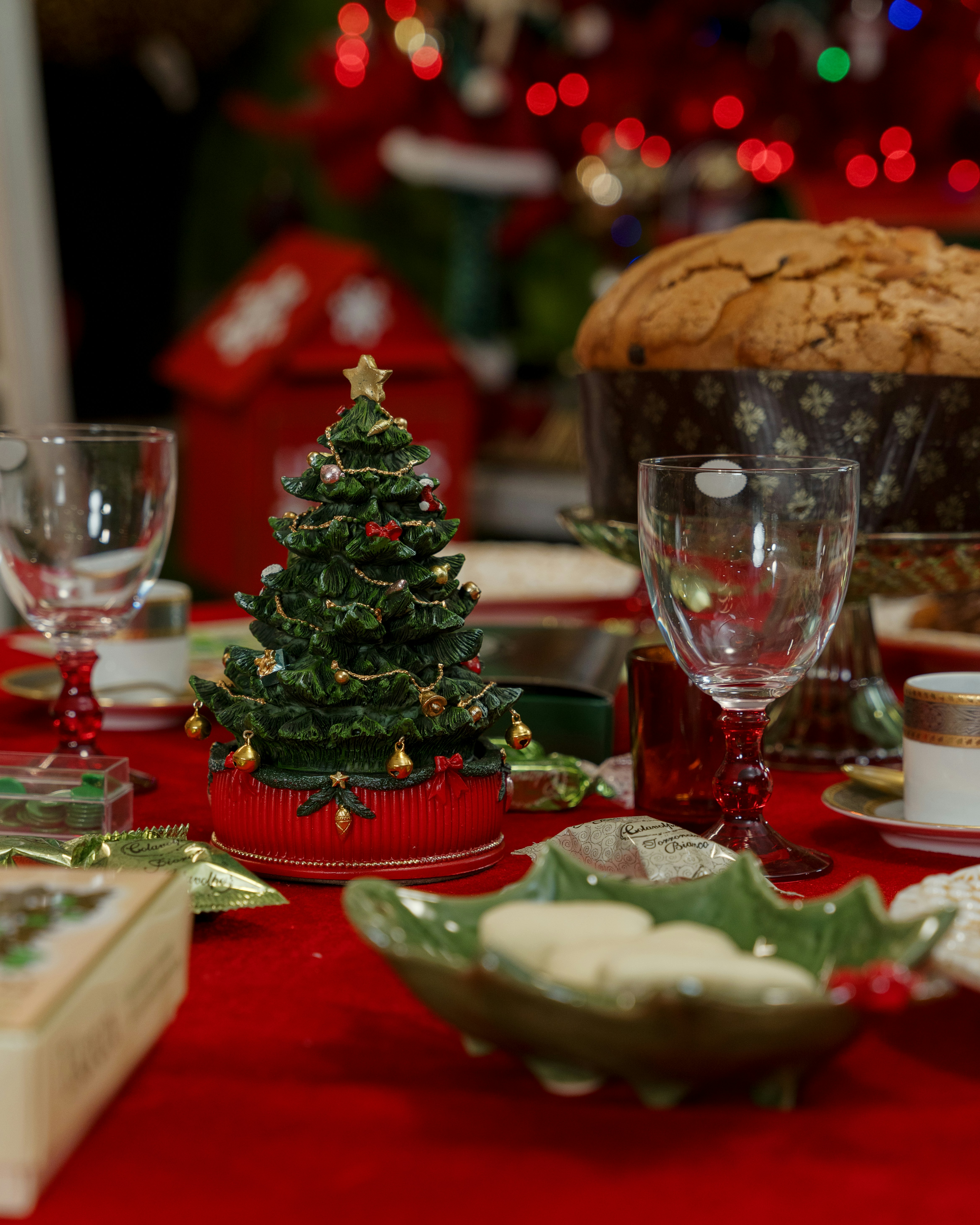 Christmas table setting with festive decorations and food.