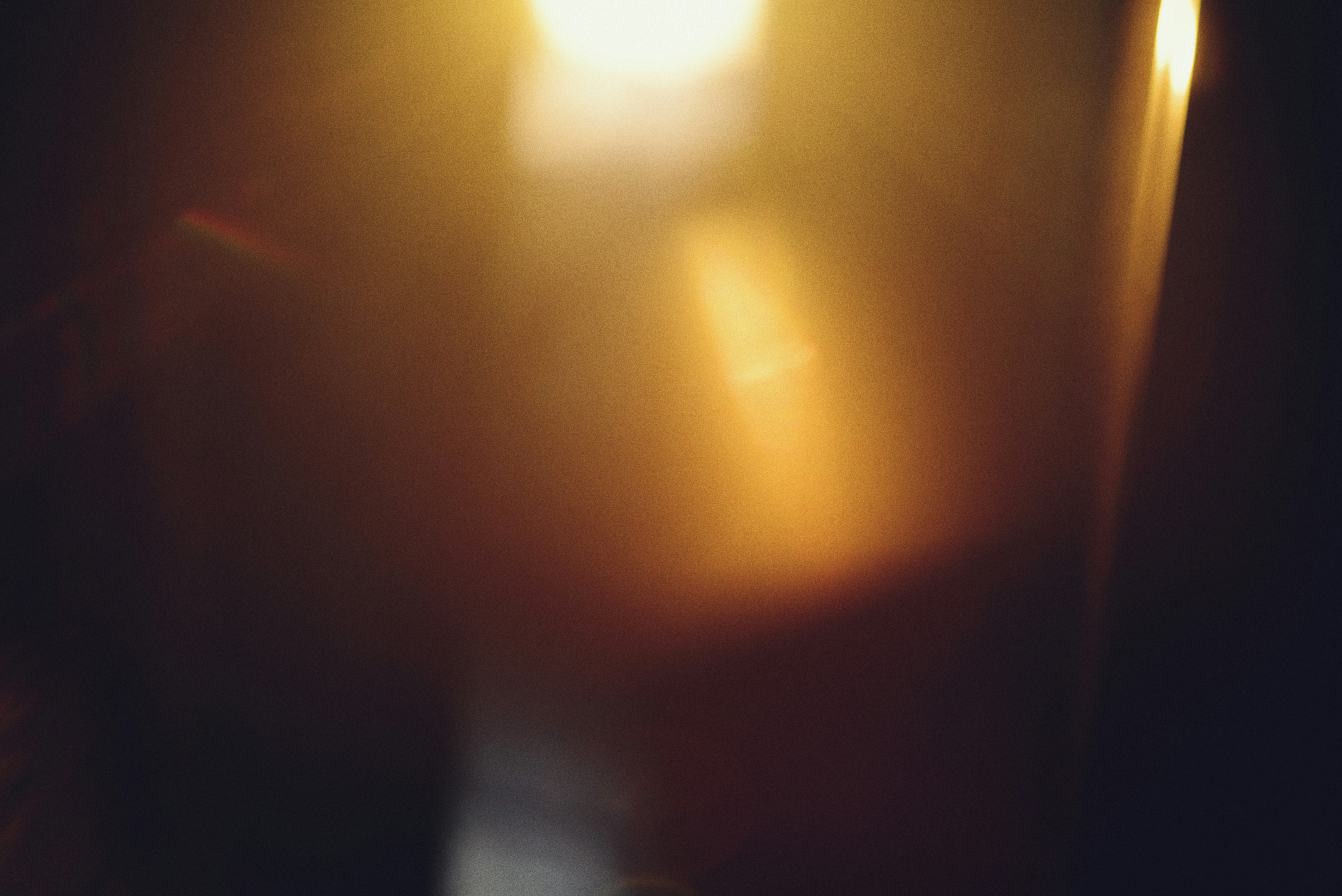 Golden light flares and bokeh on dark background