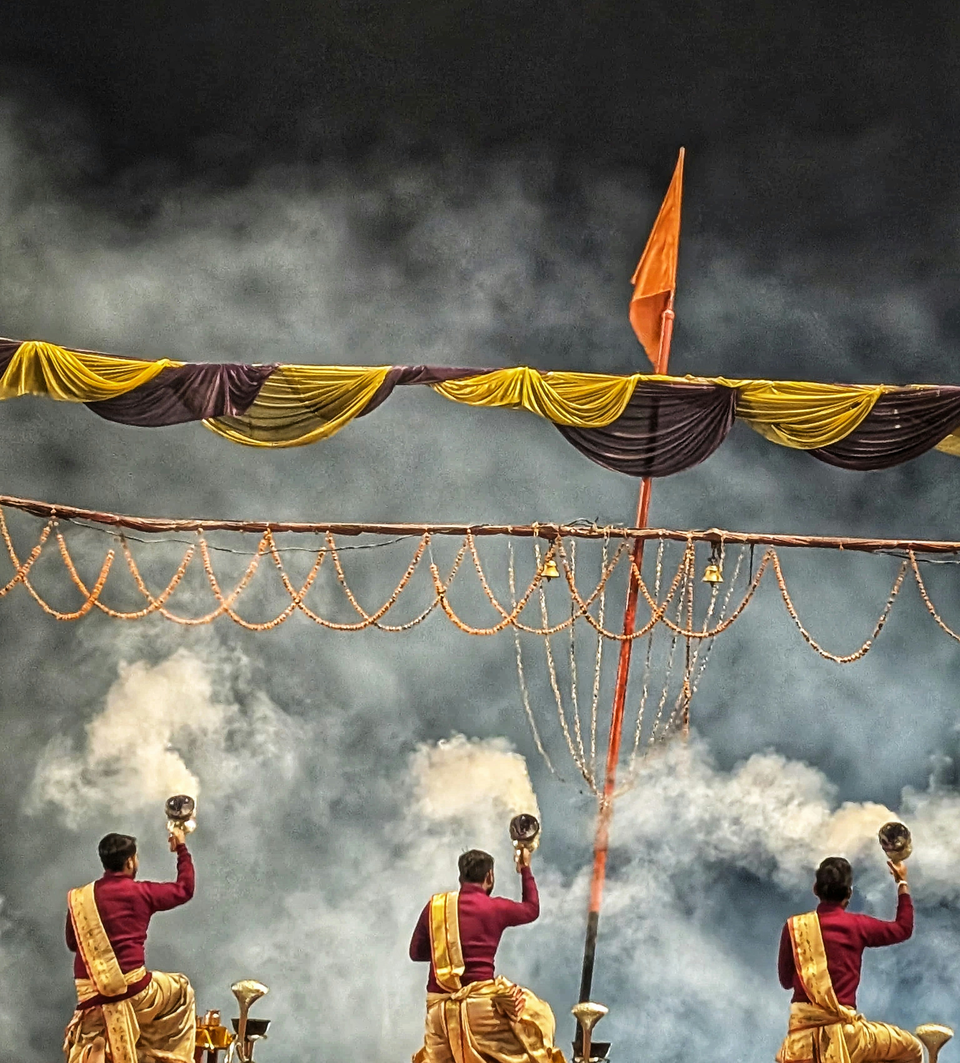 Three men performing a ritual with smoke photo – Free Worship Image on ...
