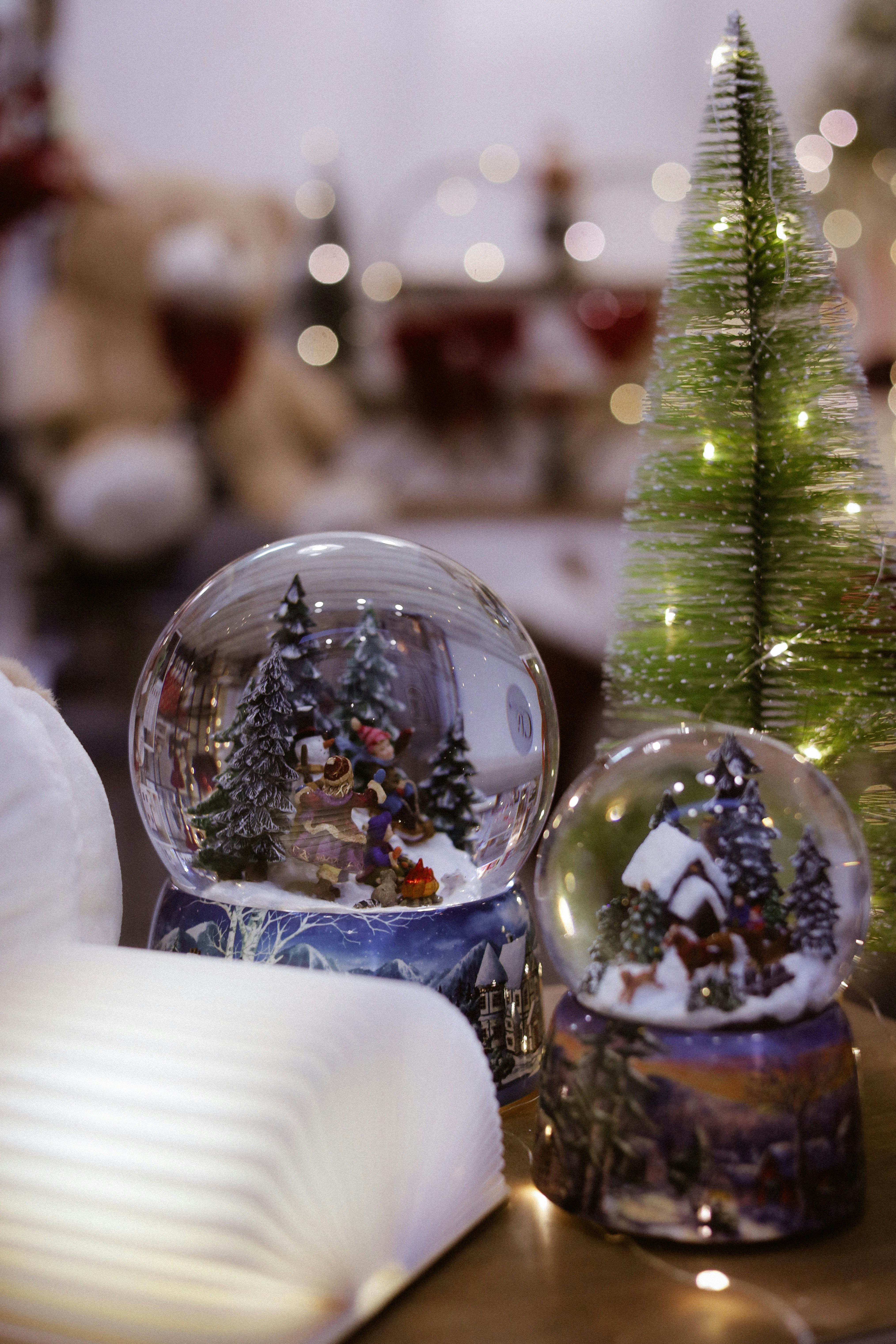 Two snow globes and a christmas tree