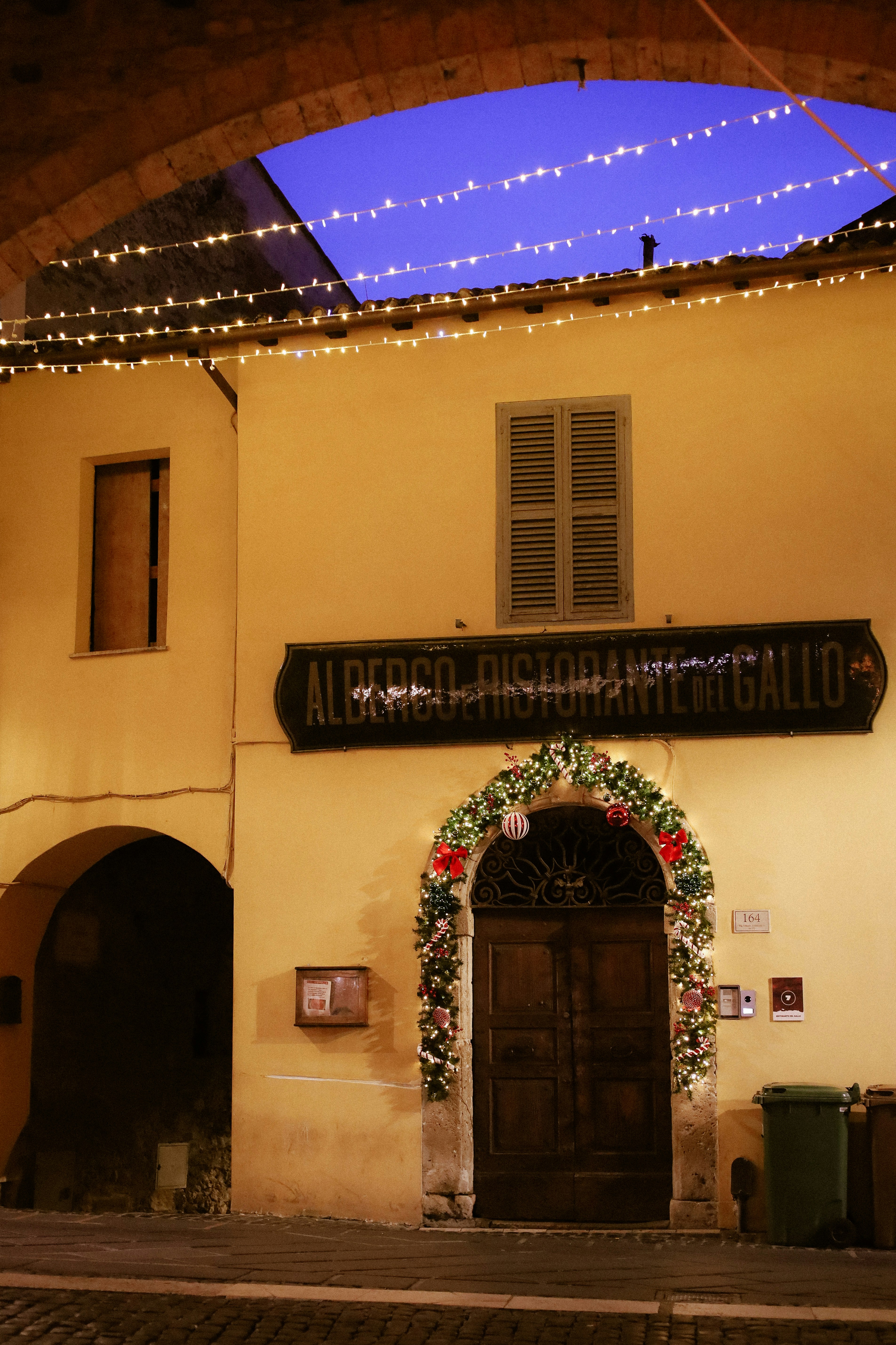Building entrance decorated for christmas with lights