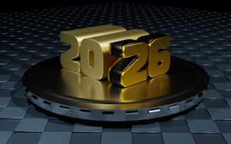 Golden 2026 numbers on a metallic platform.