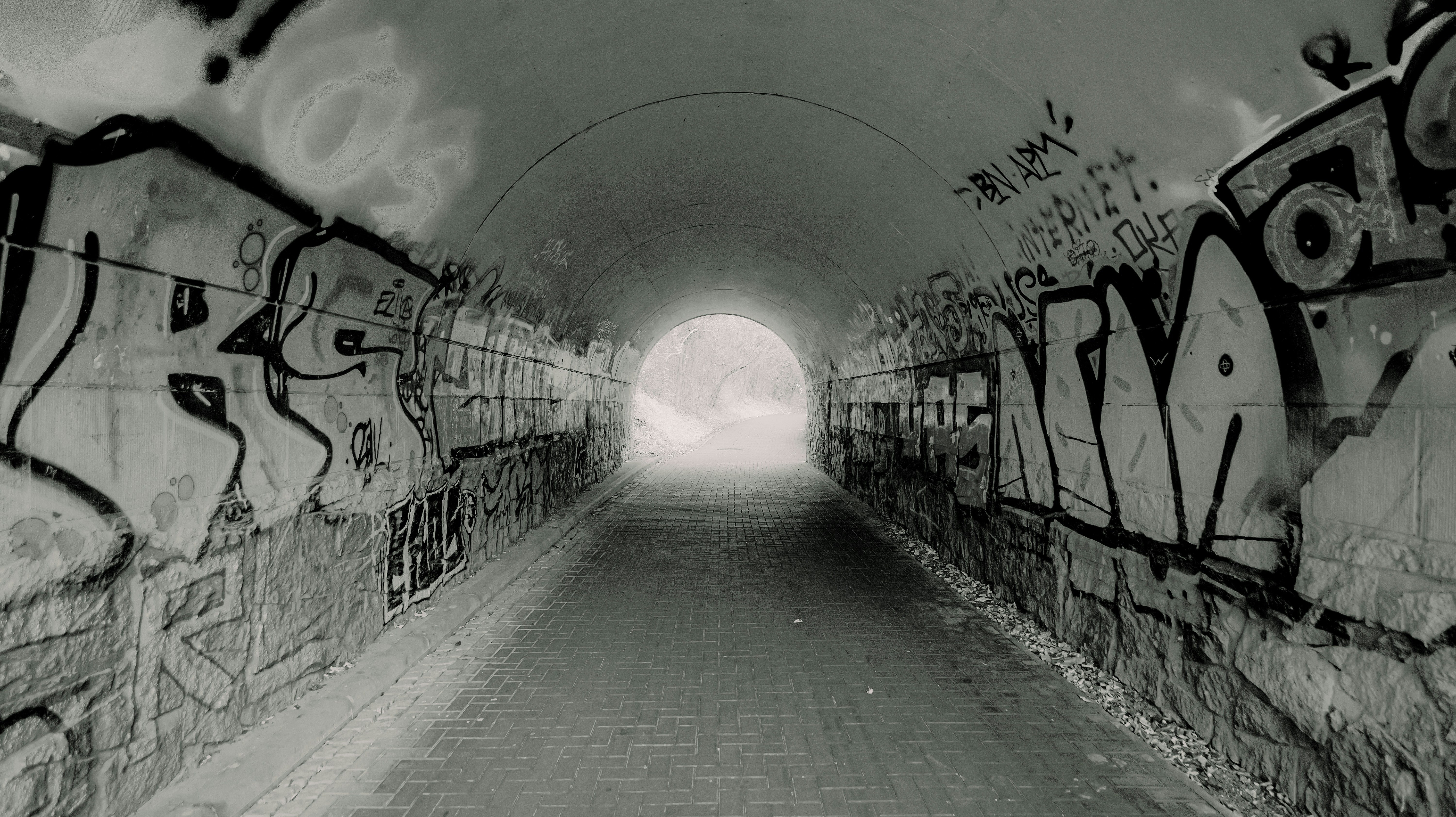 Graffiti-covered tunnel with light at the end - graffiti-covered-tunnel-with-light-at-the-end-e5CNNL9F0W8