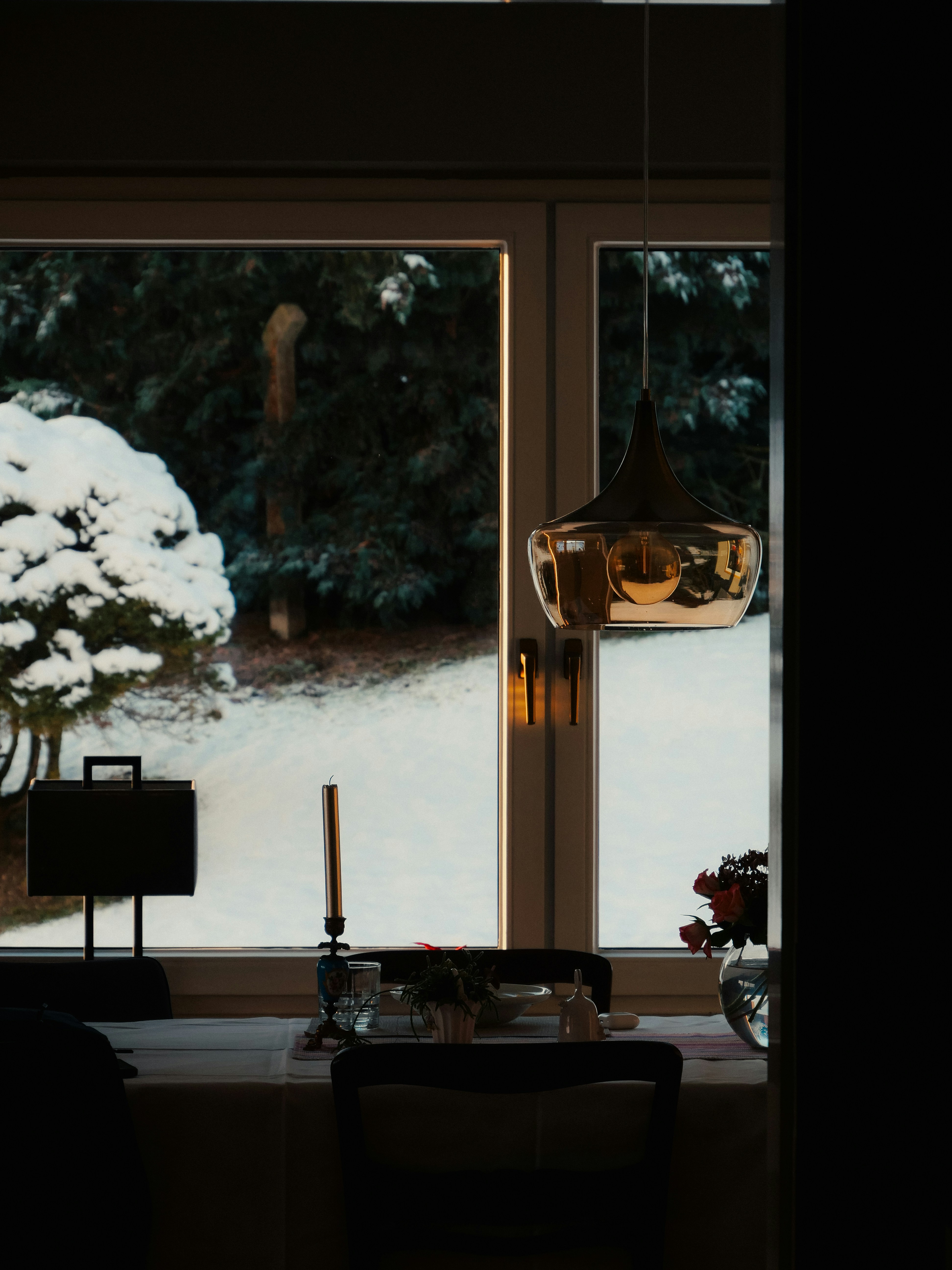 Cozy dining room with winter view through window