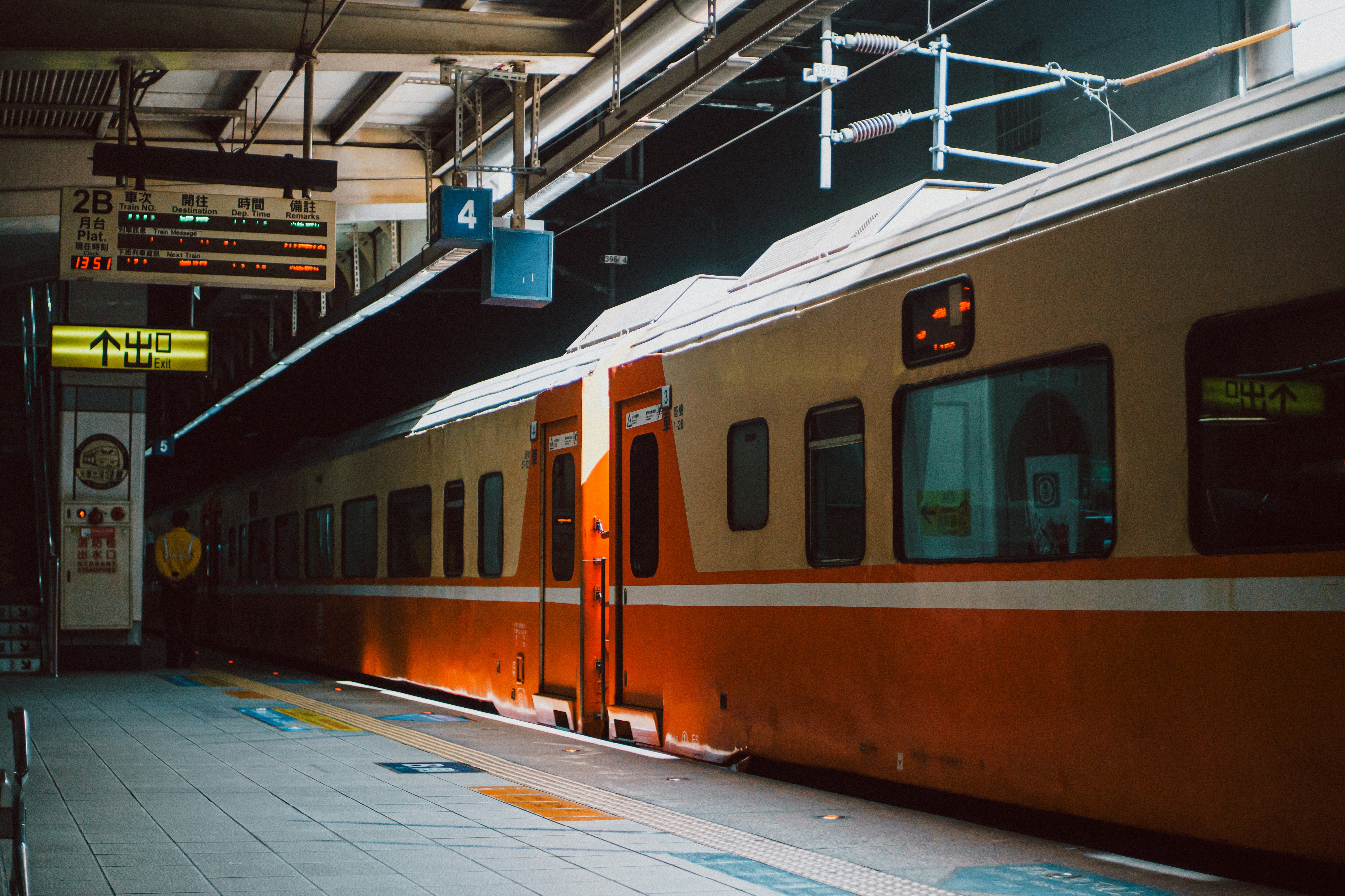 Orange and white train at a station platform
