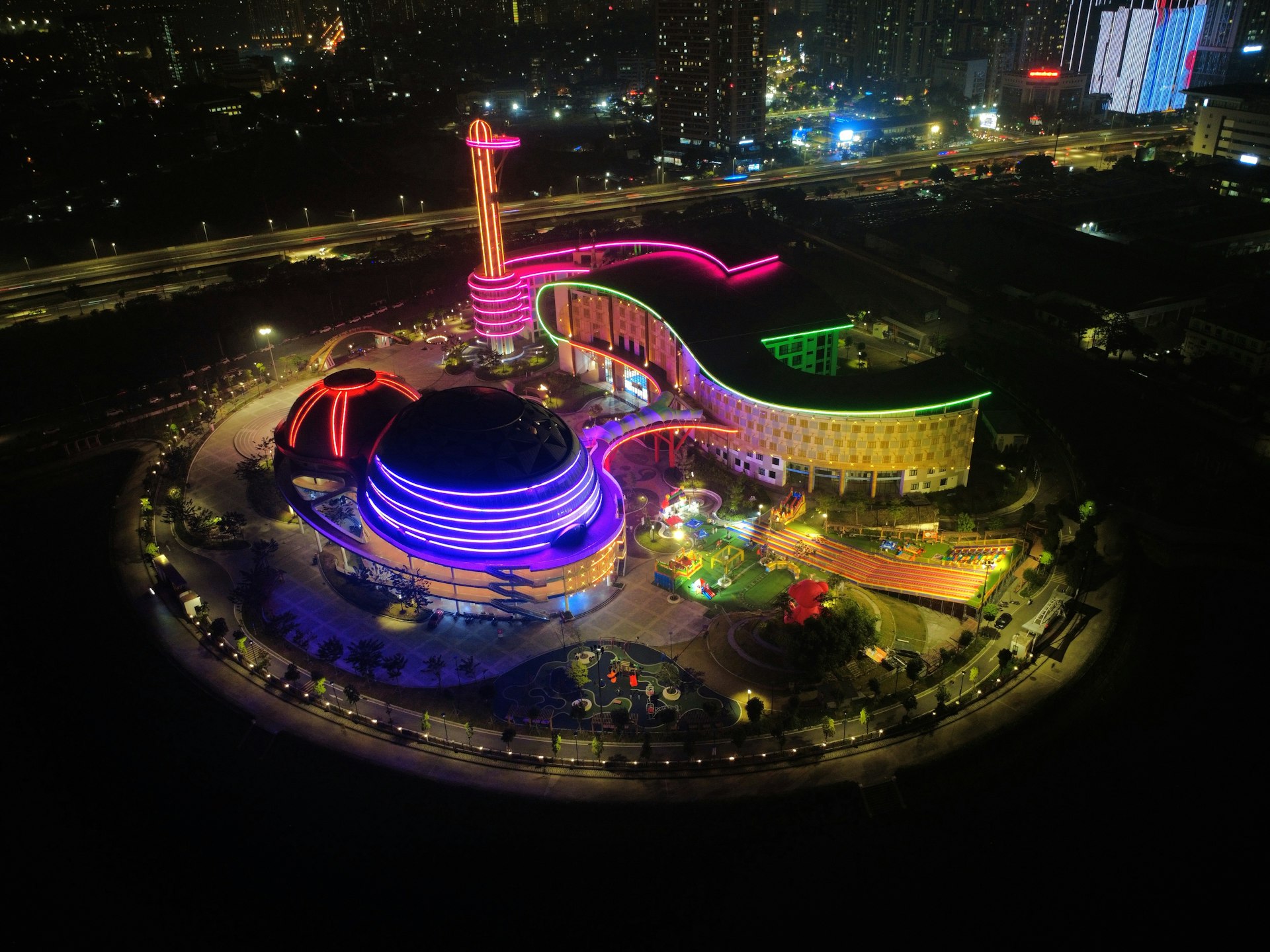 Modern building illuminated with colorful lights at night