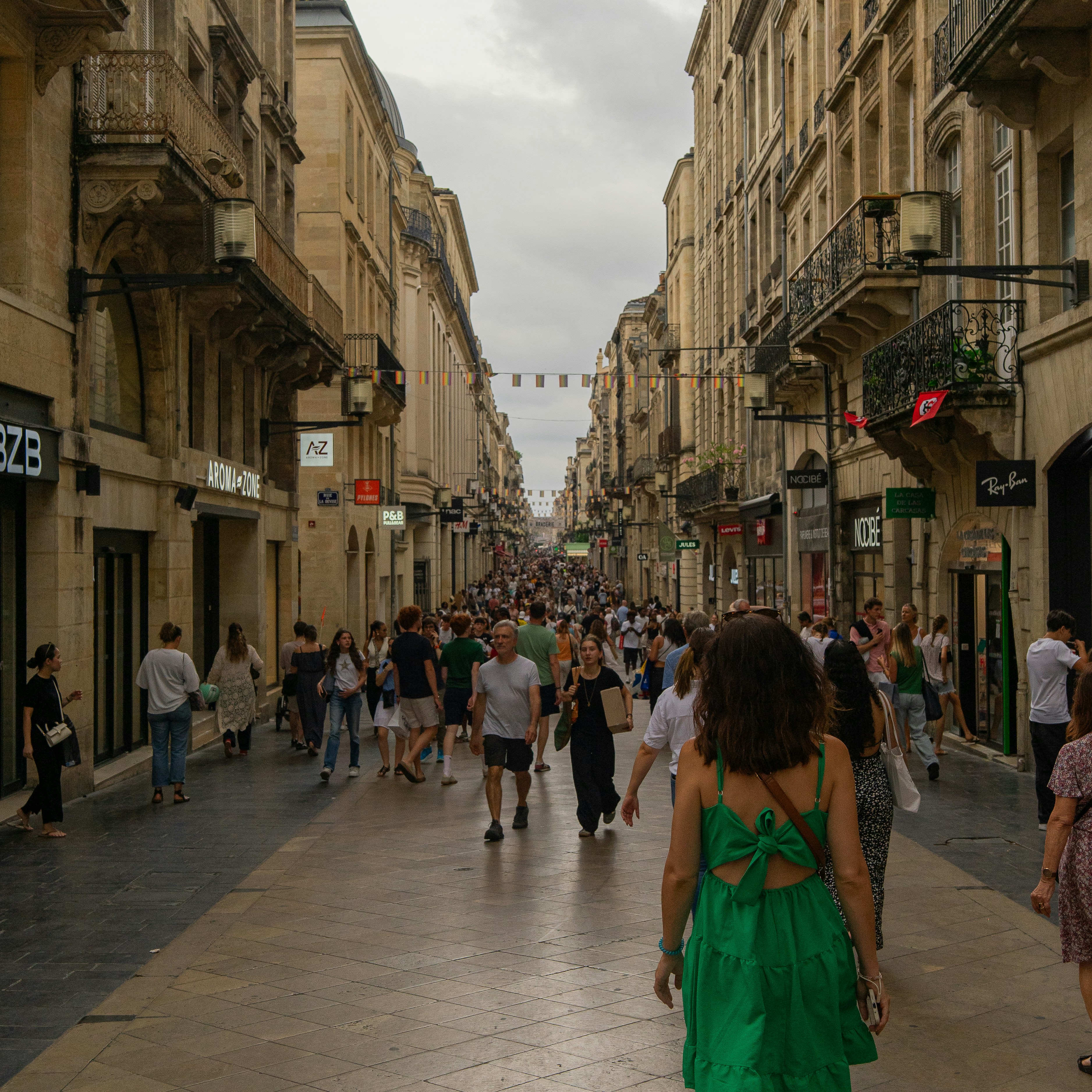 woman walking alone through a historic city street
