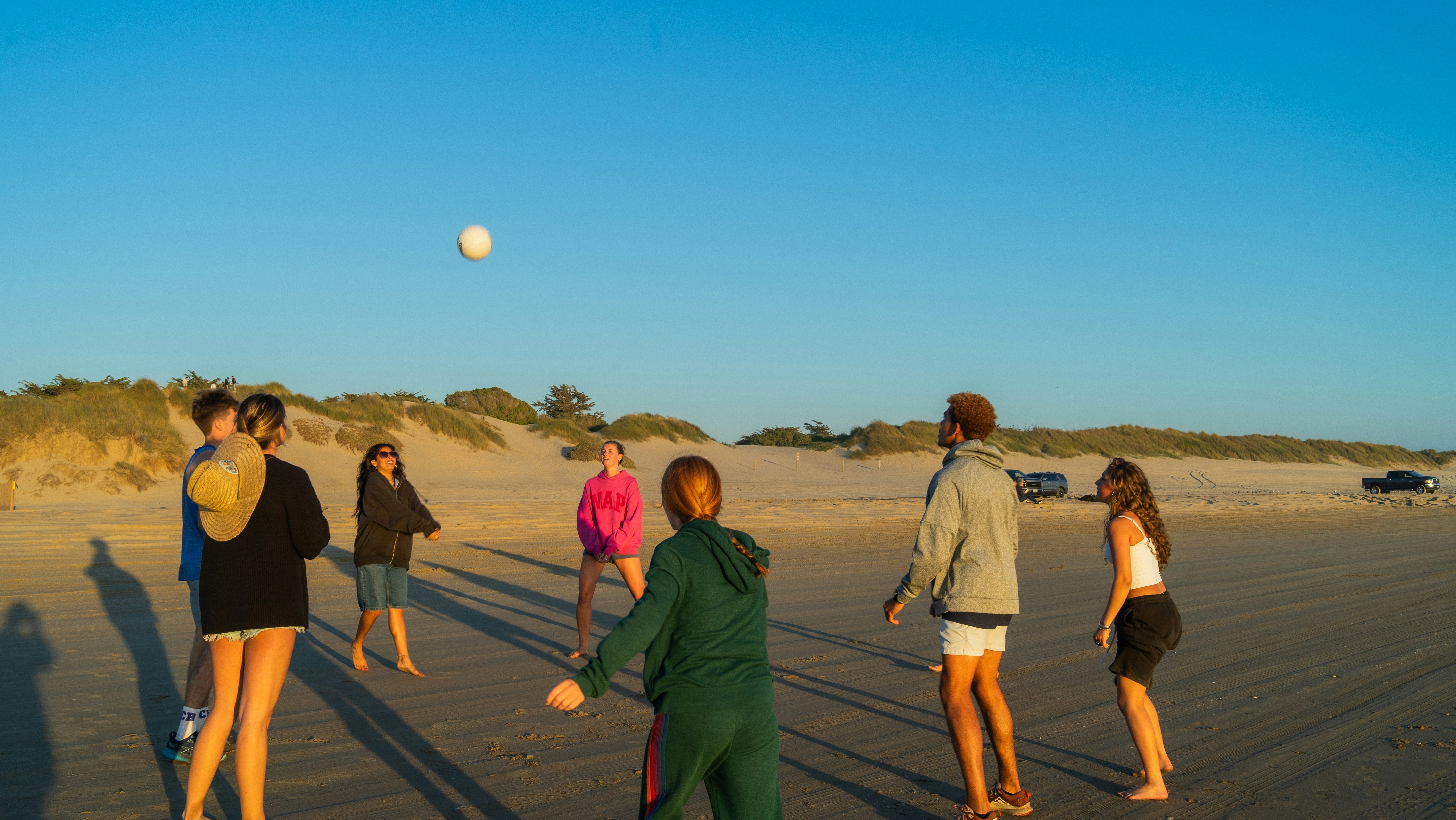 Friends playing volleyball on a beach