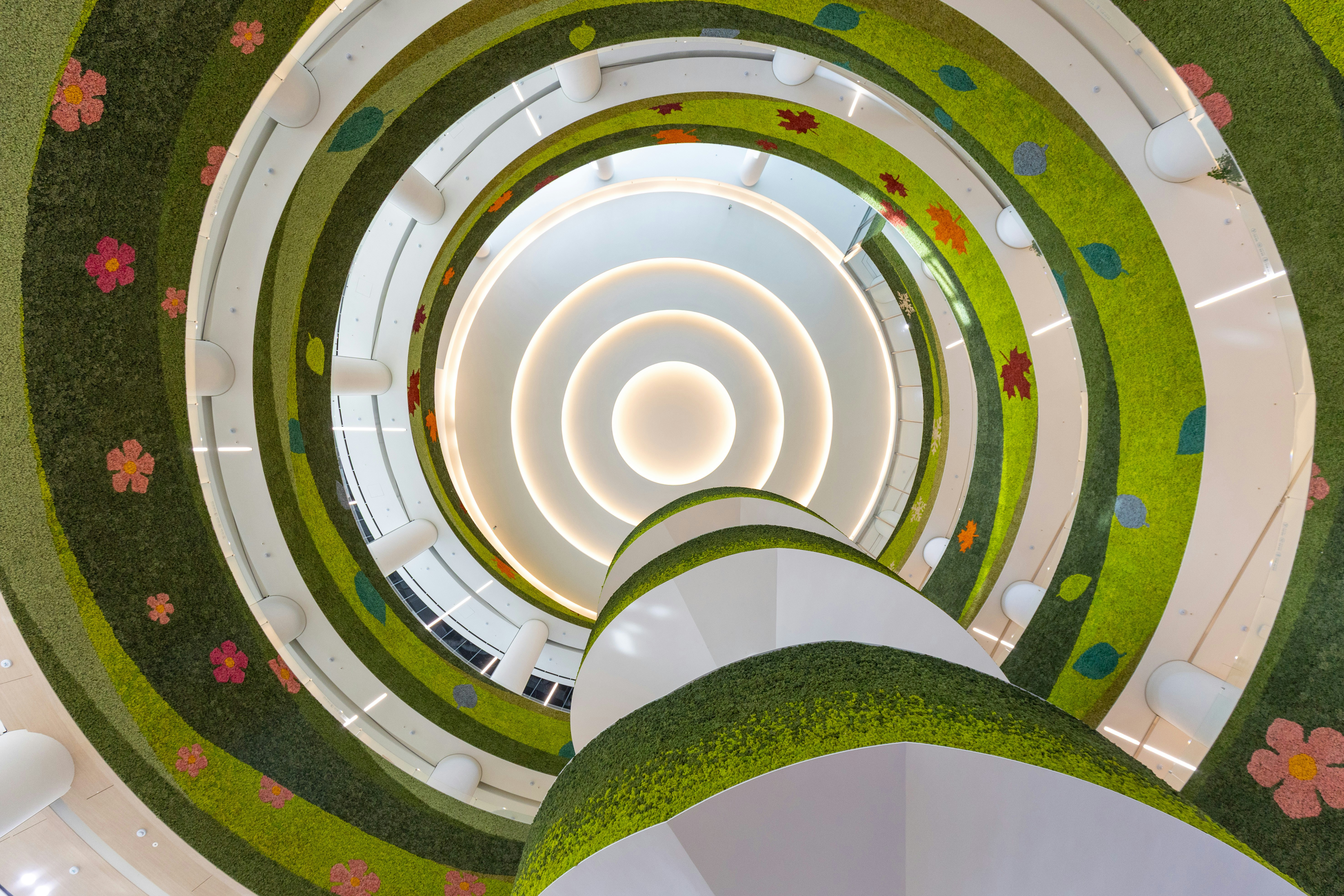 Spiral staircase with green grass and flower decorations