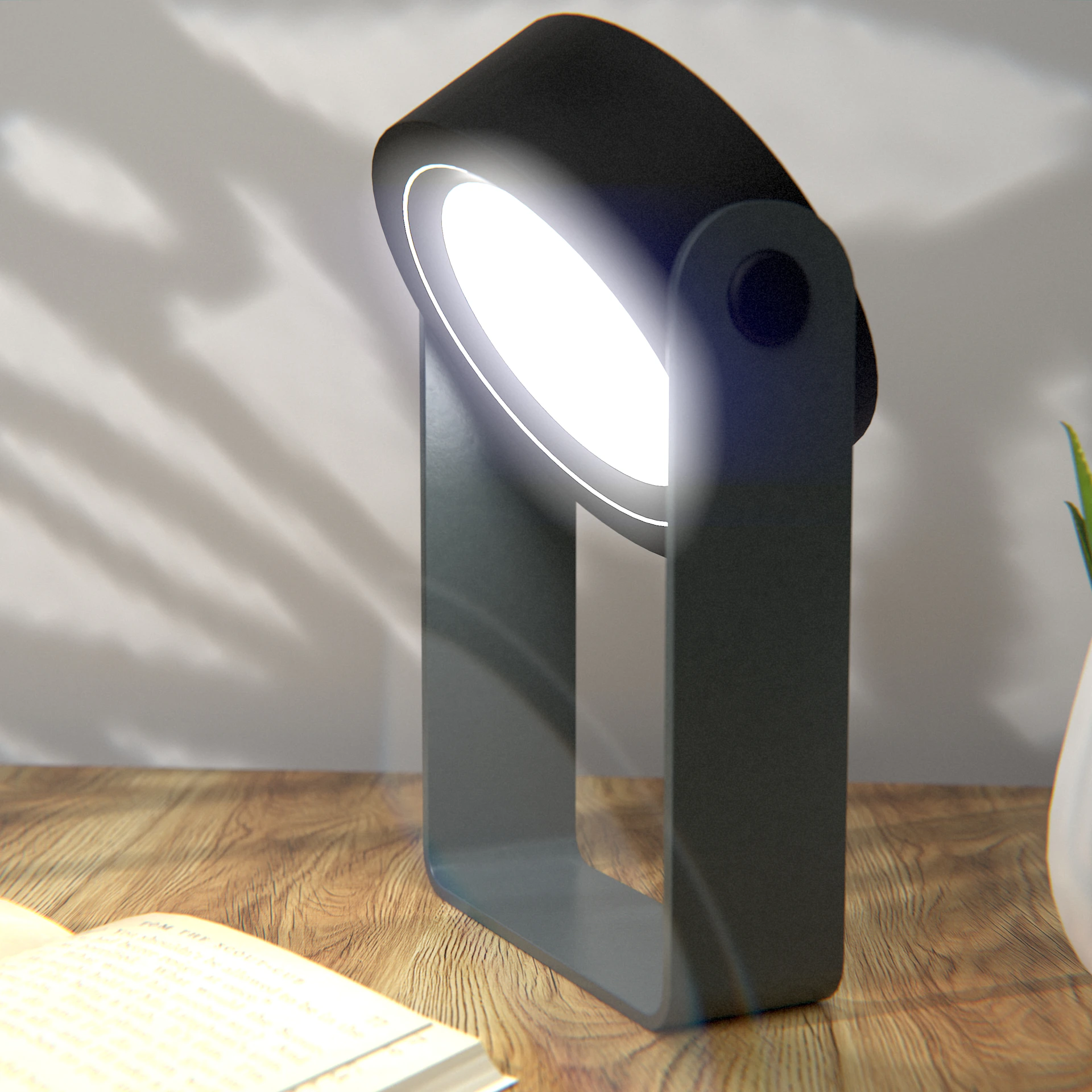 Modern black lamp illuminating a wooden desk