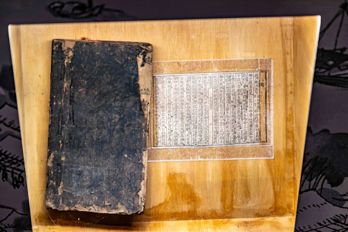 An old book and ancient manuscript on display