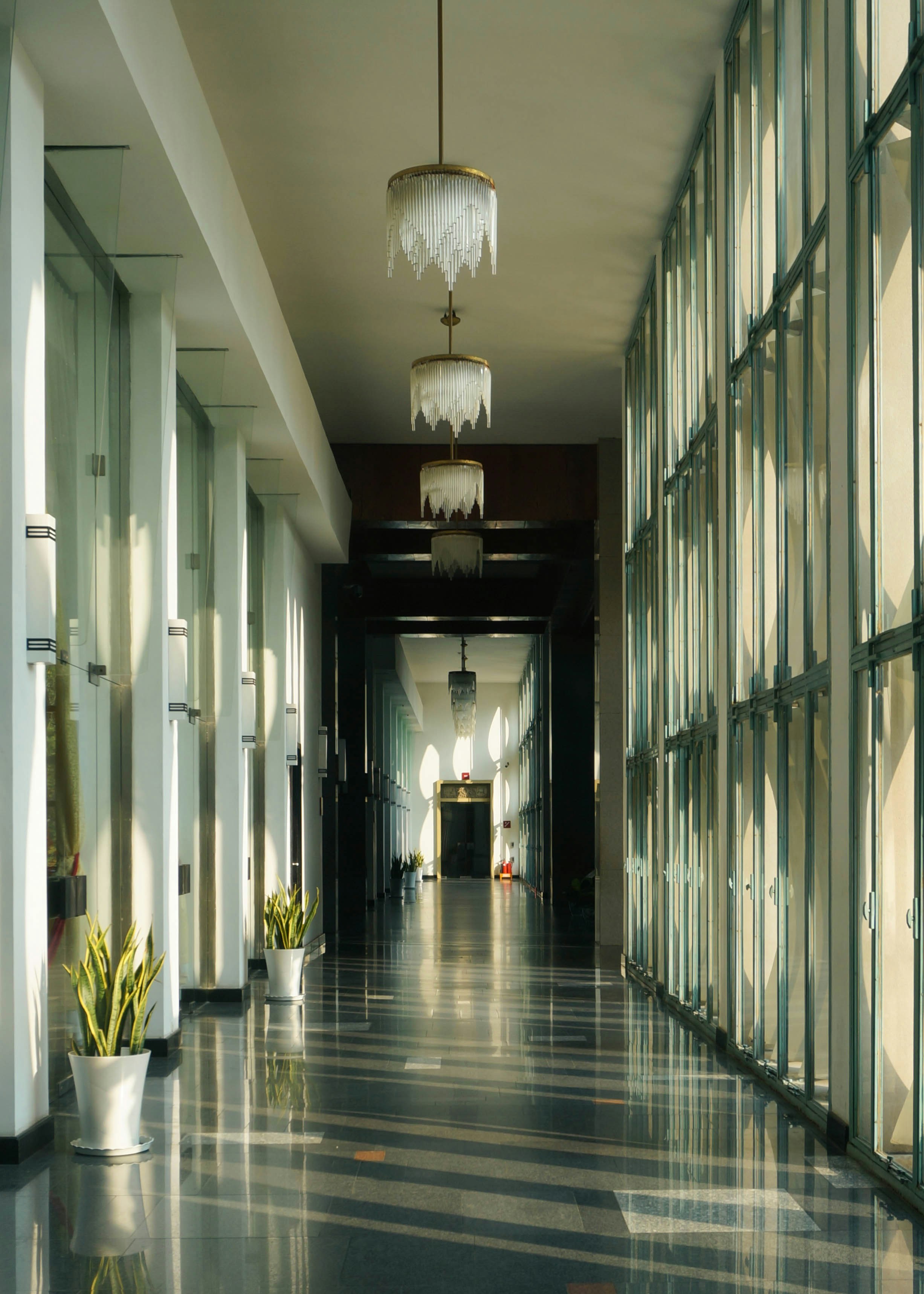 Modern hallway with sunlight streaming through windows