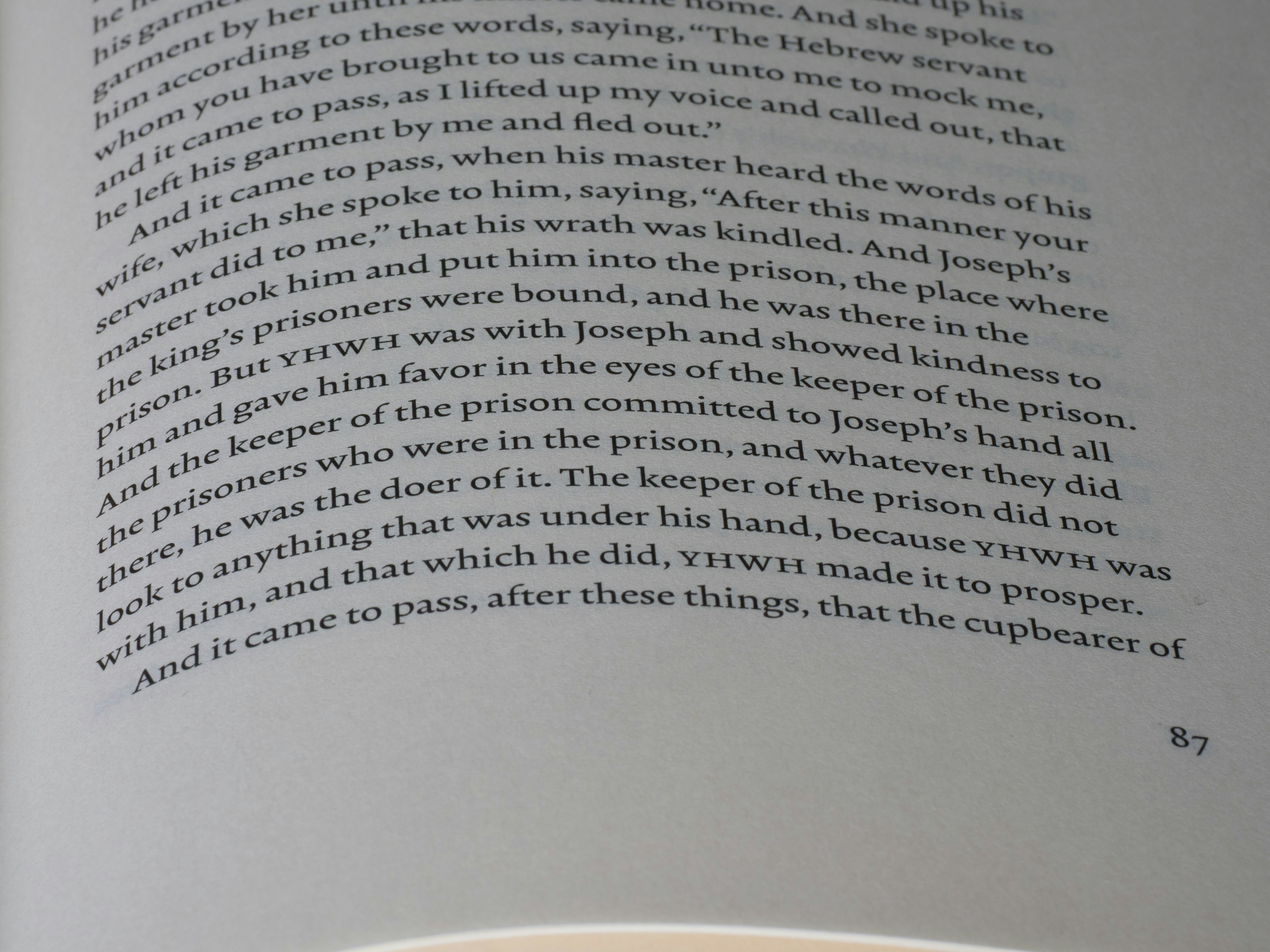 Close-up of text in a book with page number 67.