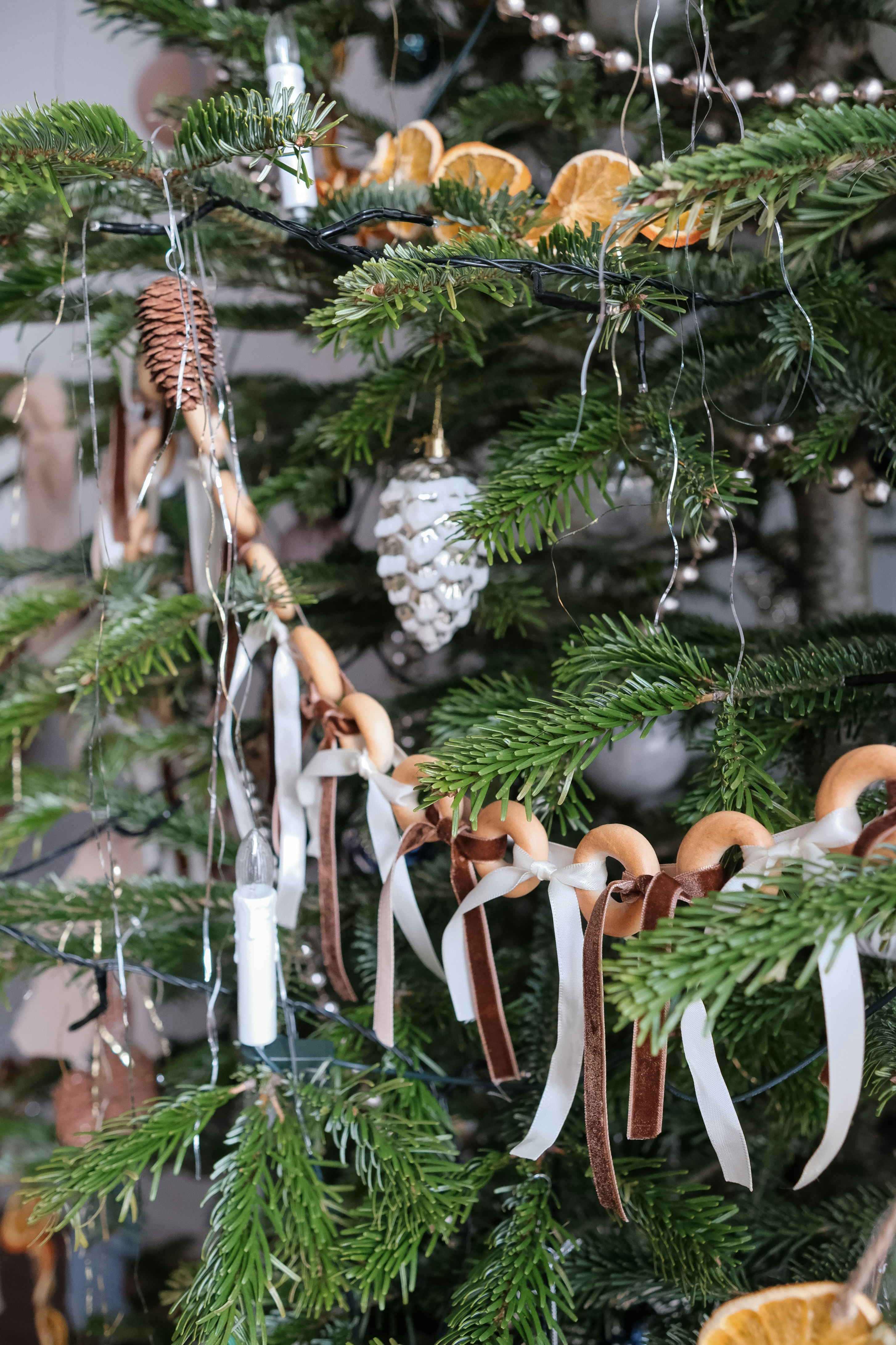 Christmas tree decorated with dried oranges and pinecones