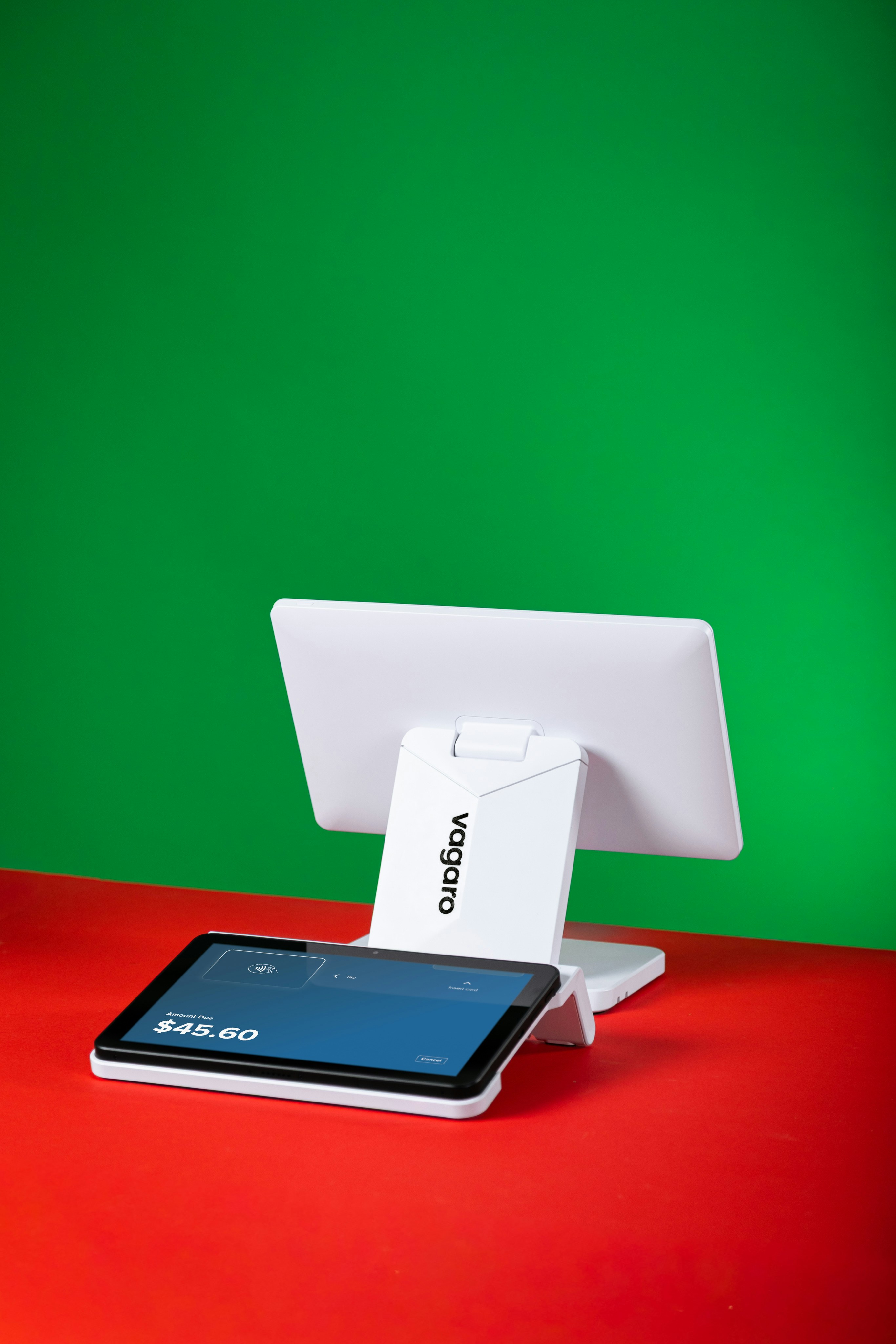 White tablet and screen on red and green background