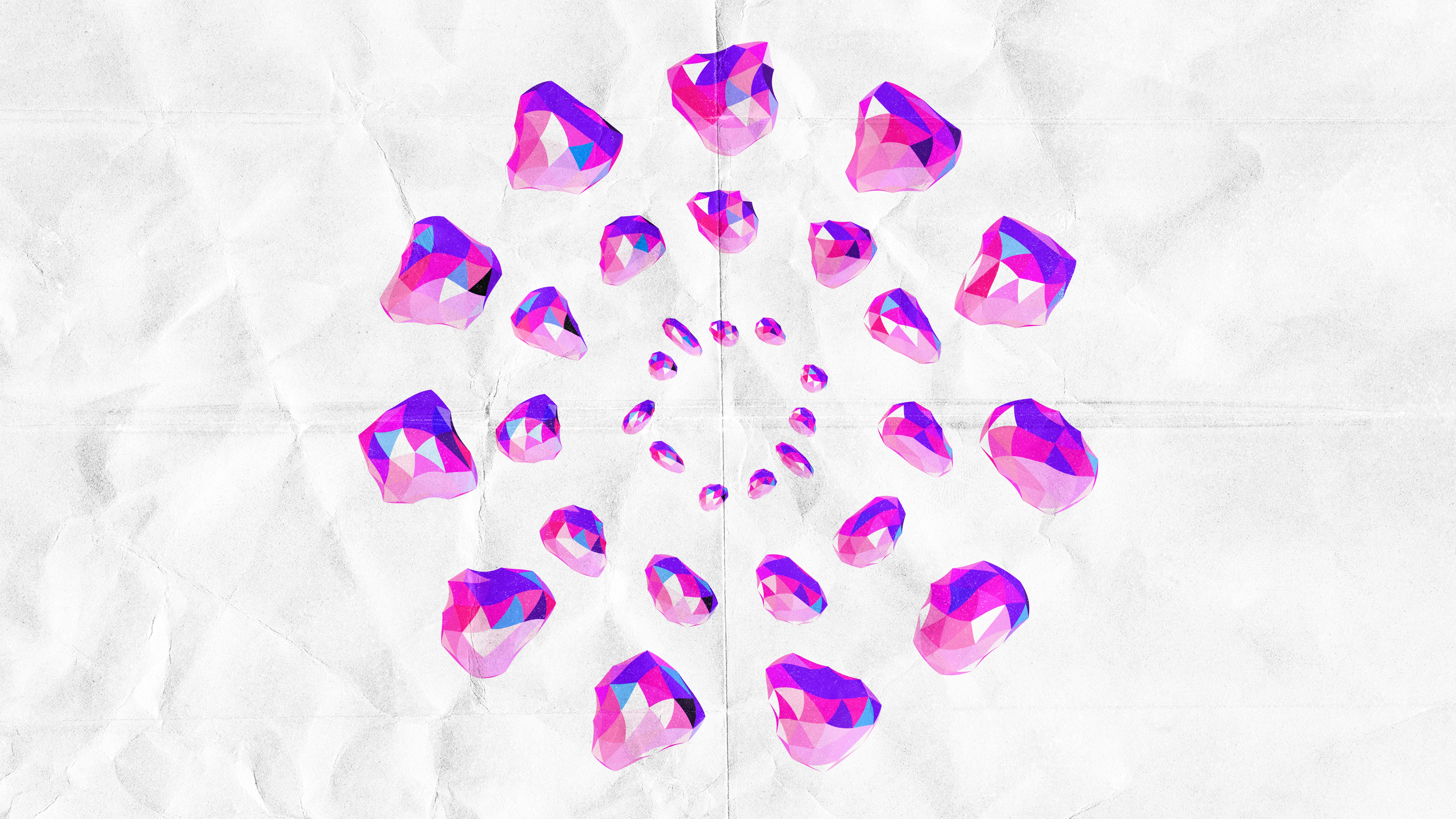 Pink and purple crystals arranged in a circular pattern.