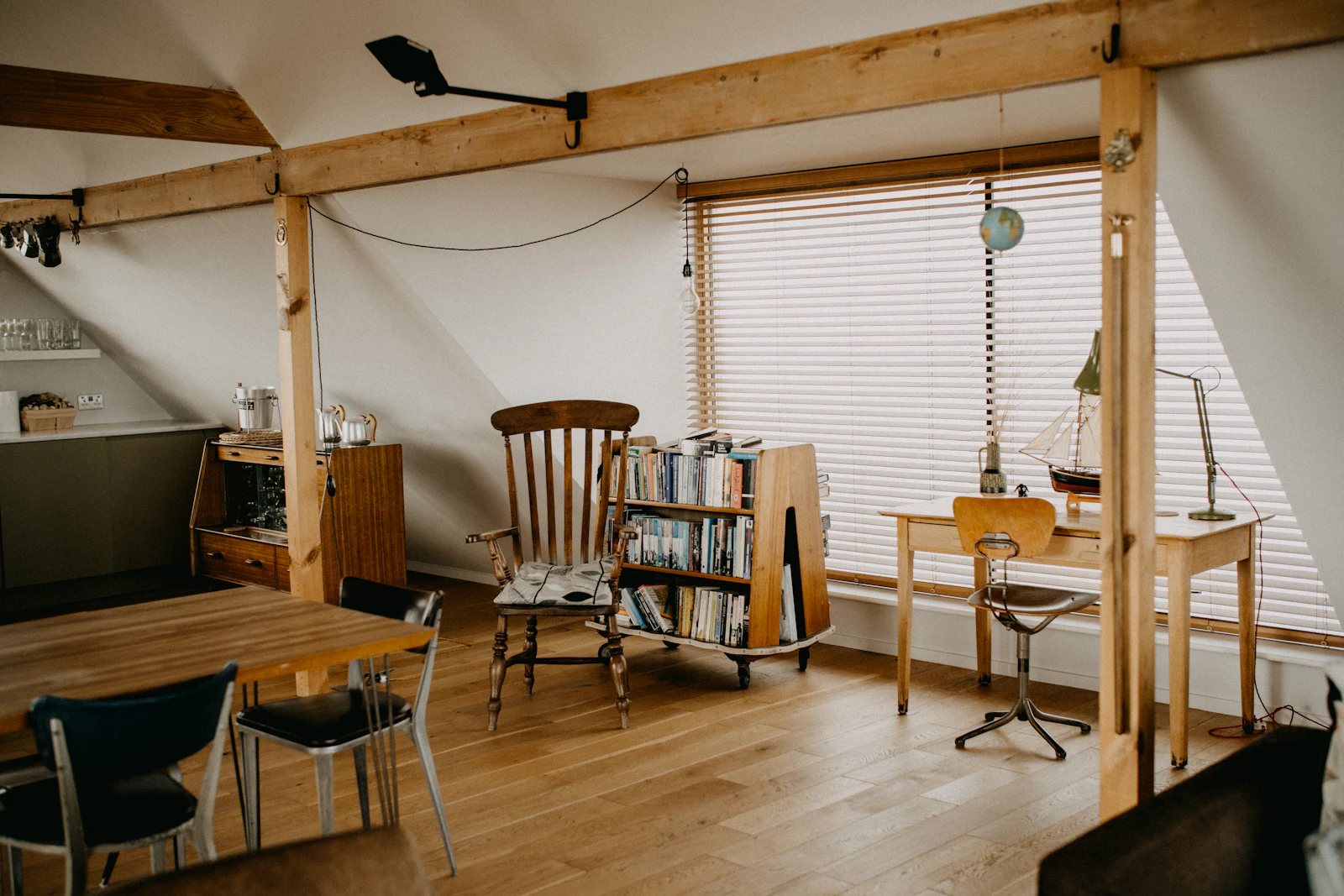 A cozy reading nook with bookshelves and chairs