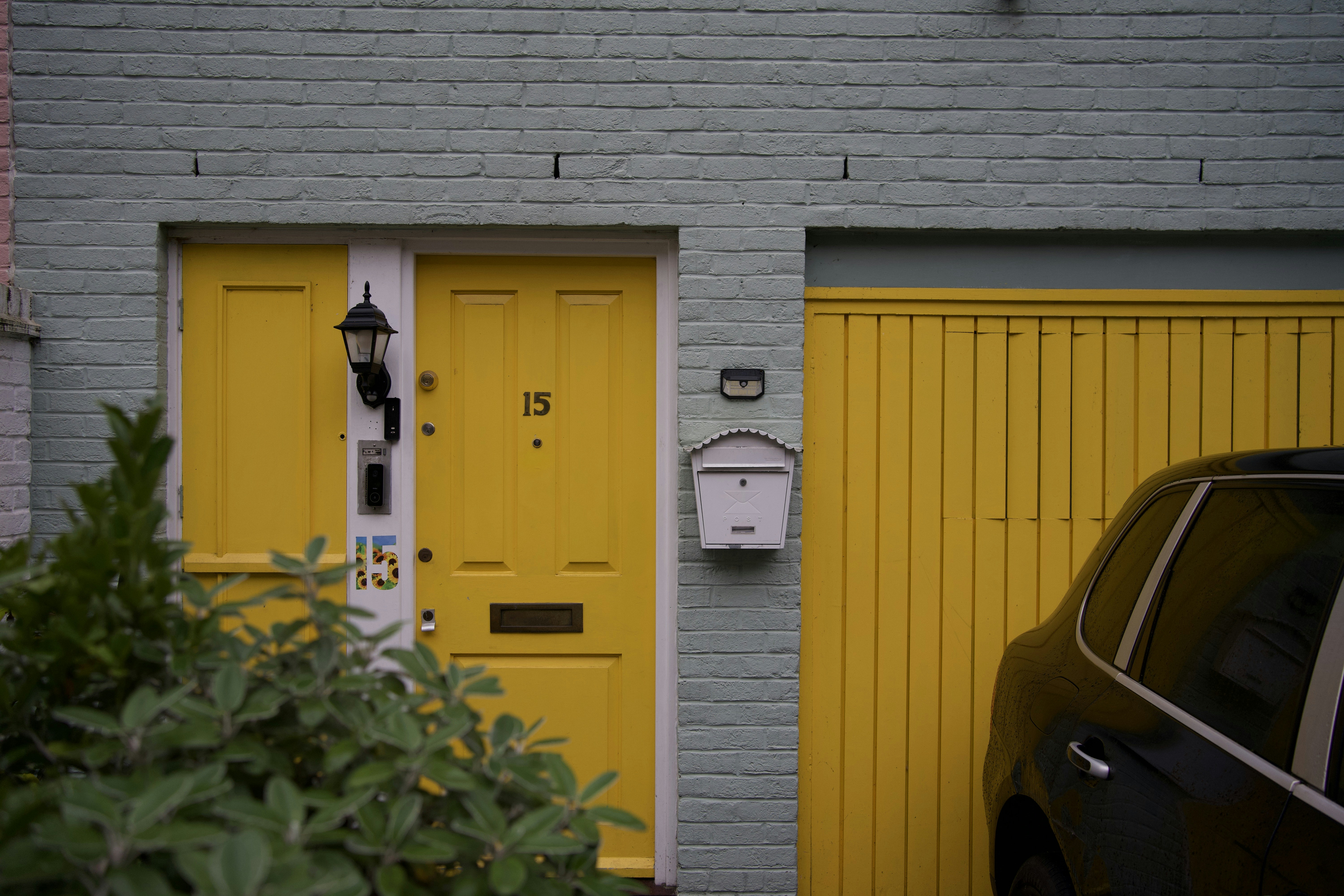 vibrant painted front door boosting curb appeal - home improvements on a budget