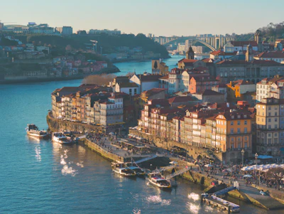 Boats docked along a river in a european city.