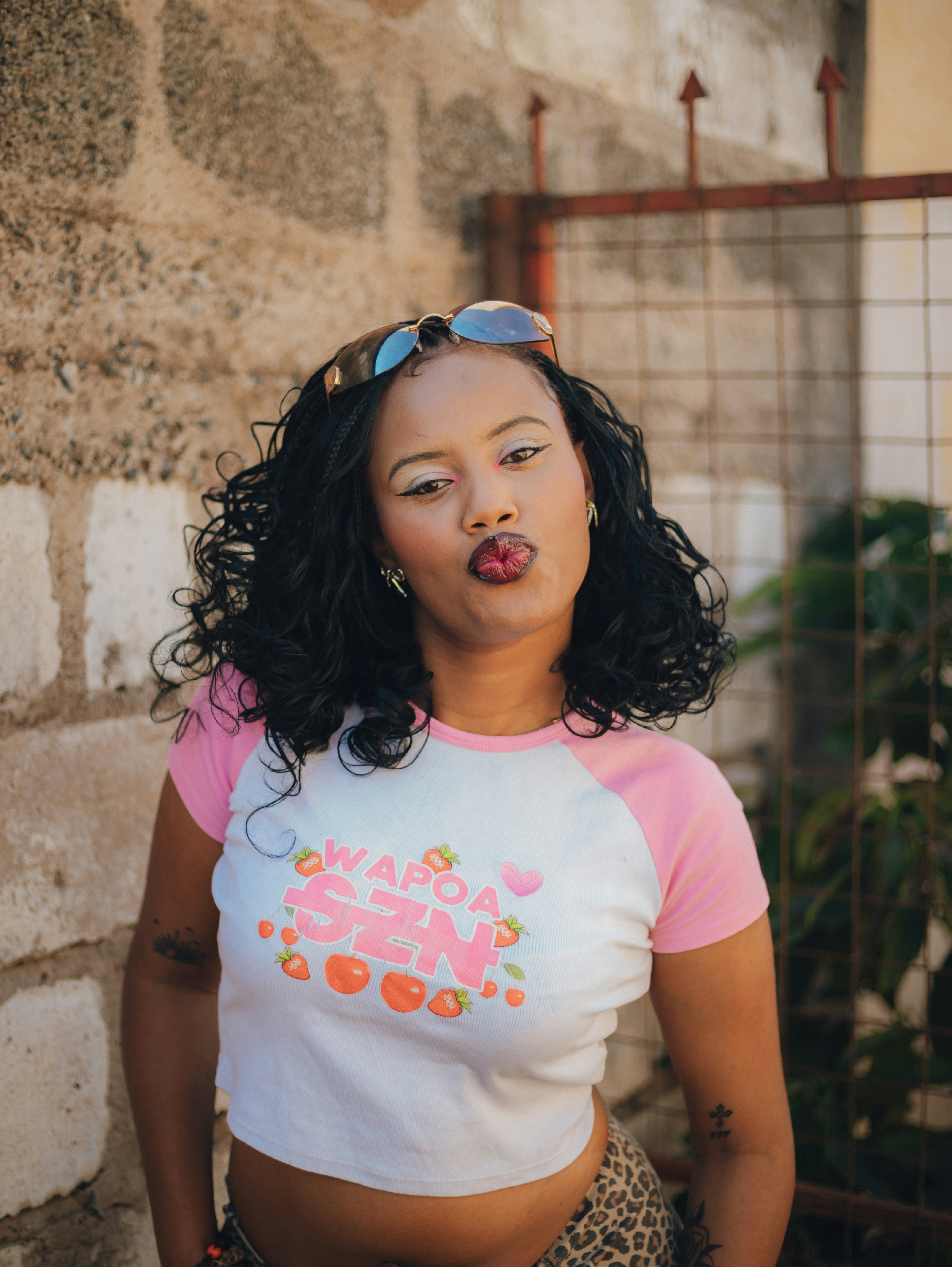 Young woman puckering lips in a crop top.