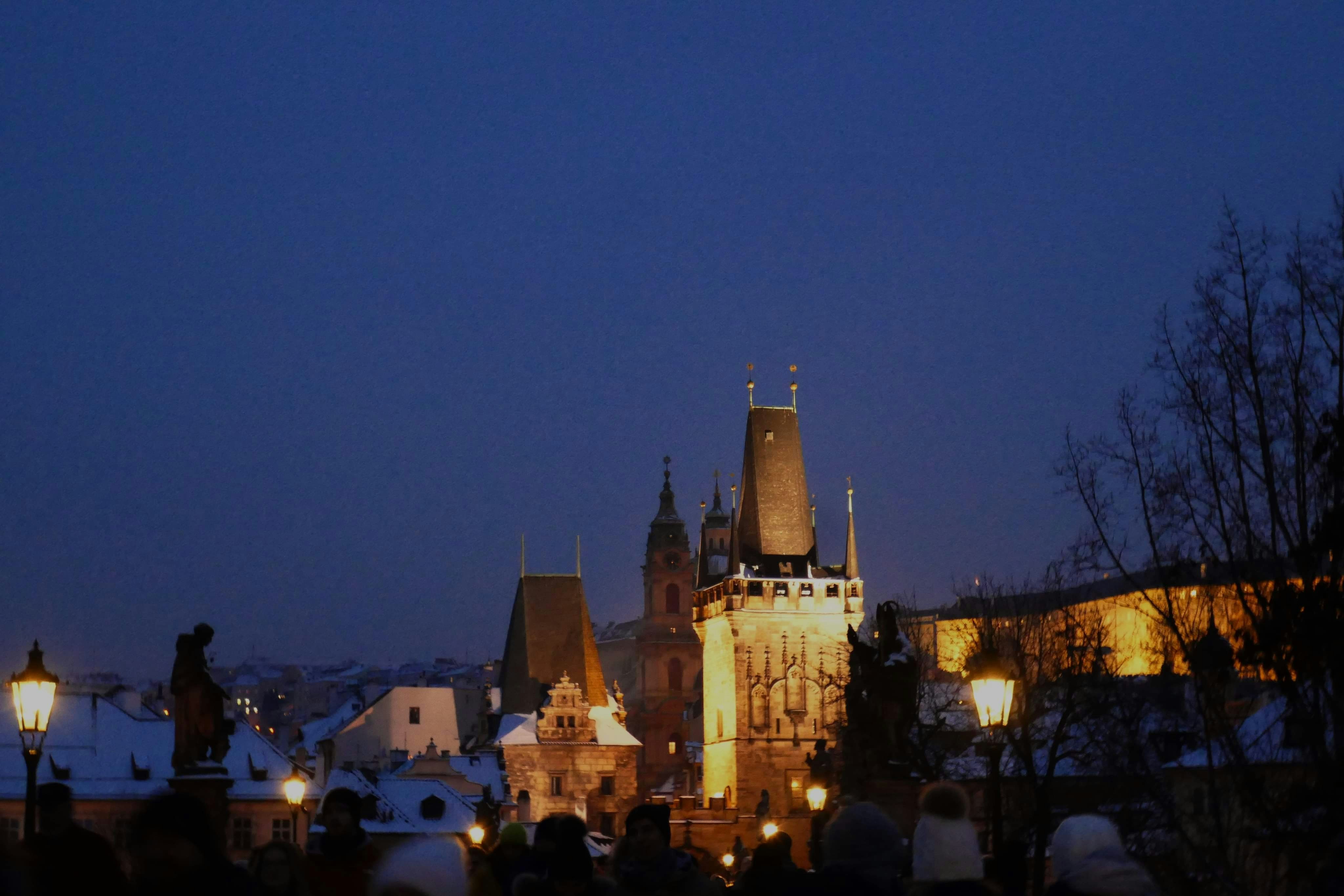 City skyline with illuminated towers at dusk