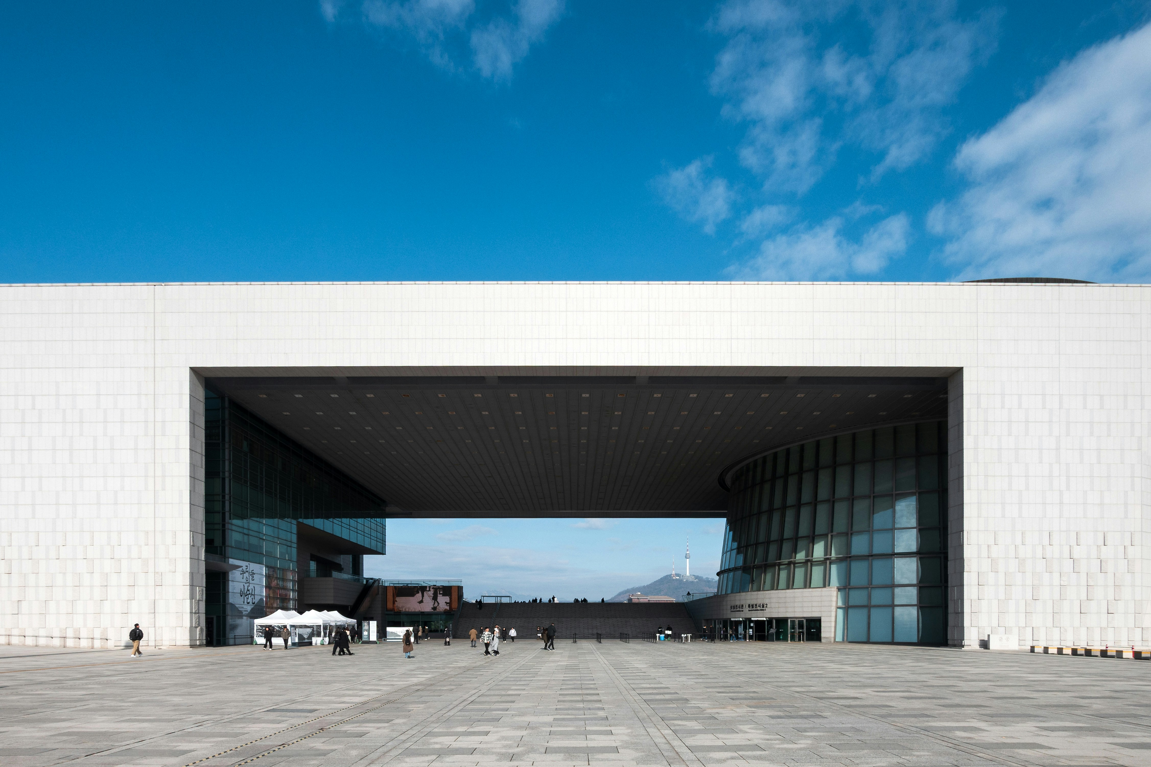 Modern building with large open entrance and blue sky