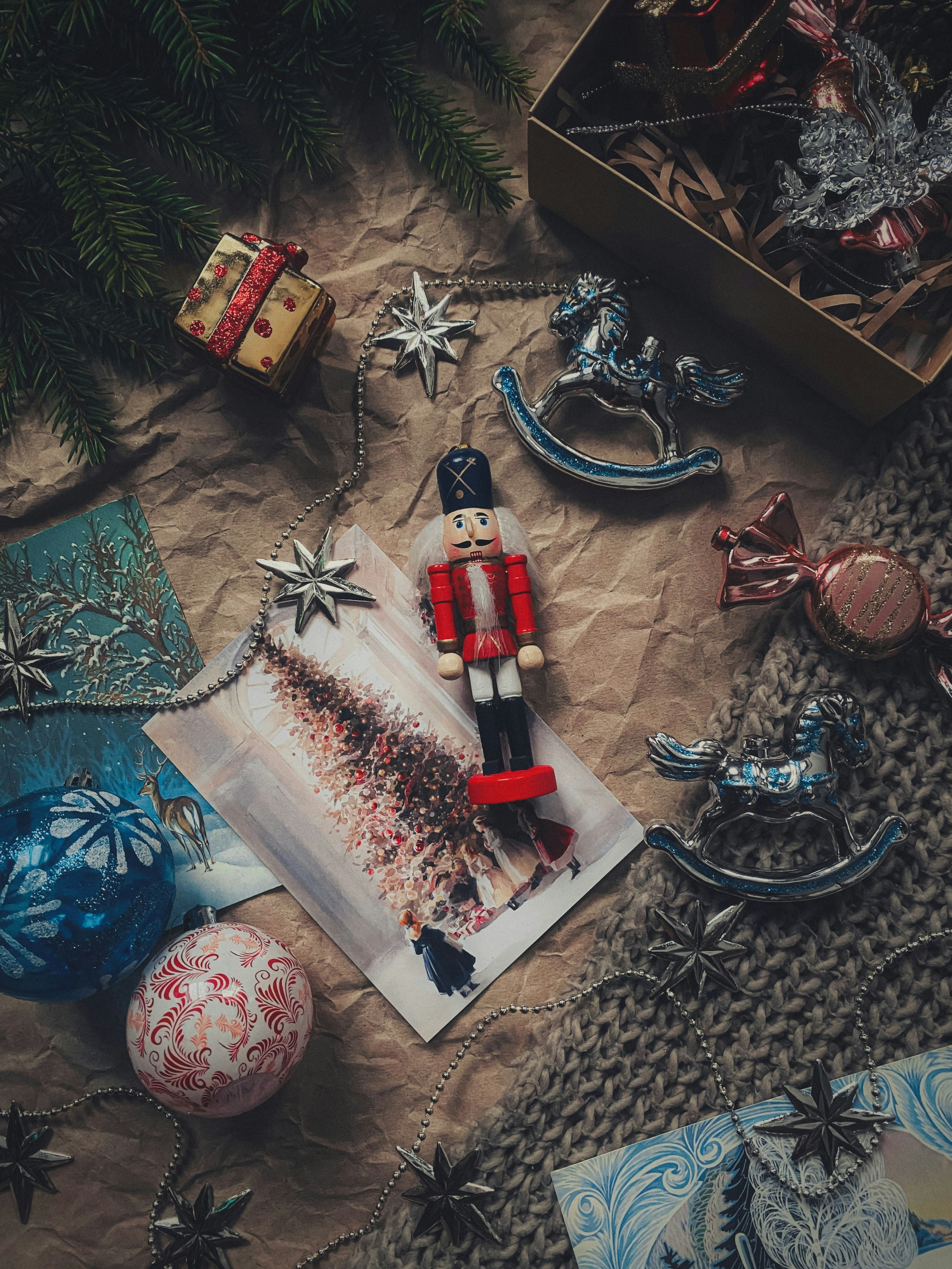 Christmas ornaments and vintage decorations on crumpled paper.
