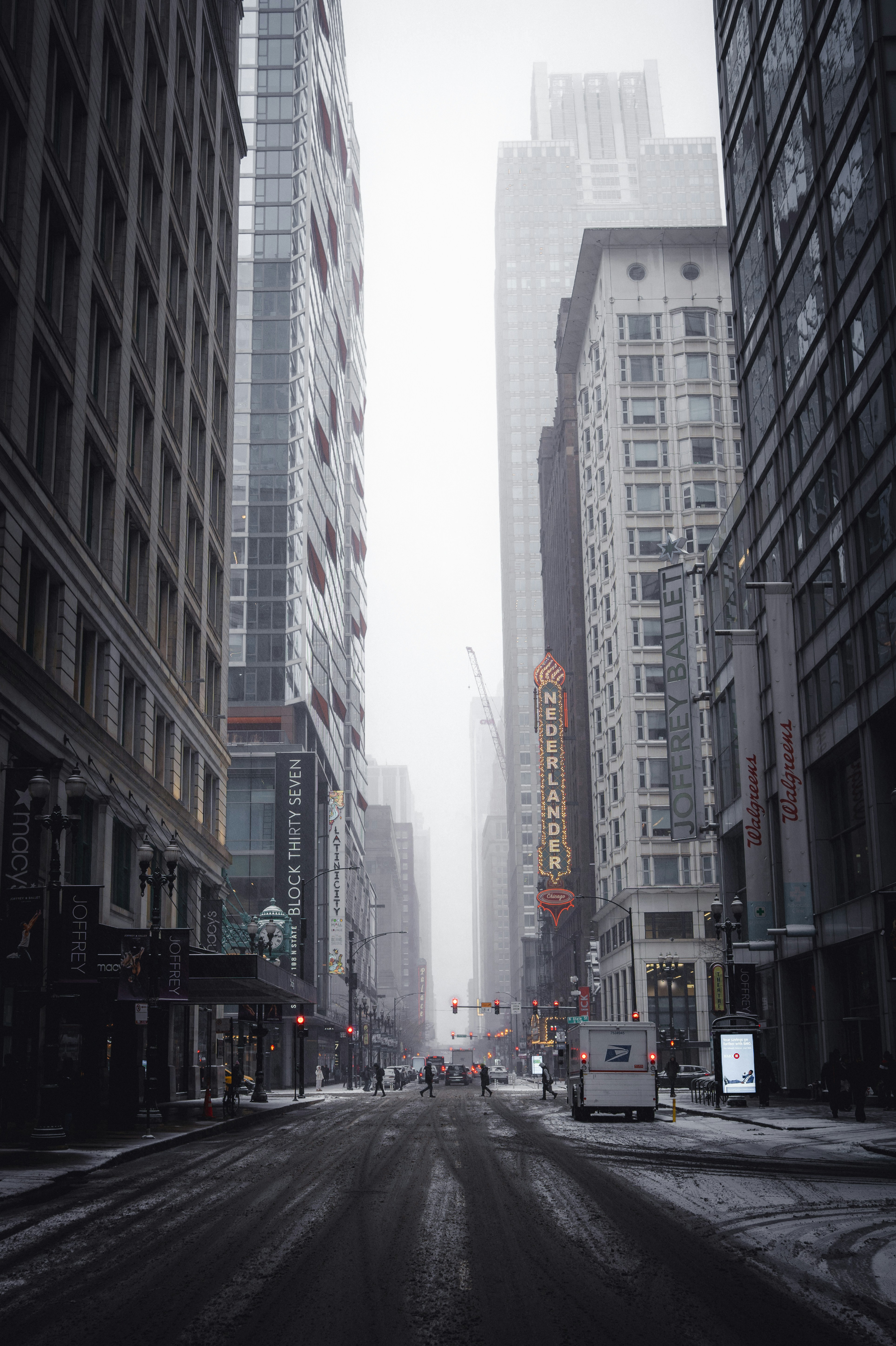 City street with tall buildings on a foggy day