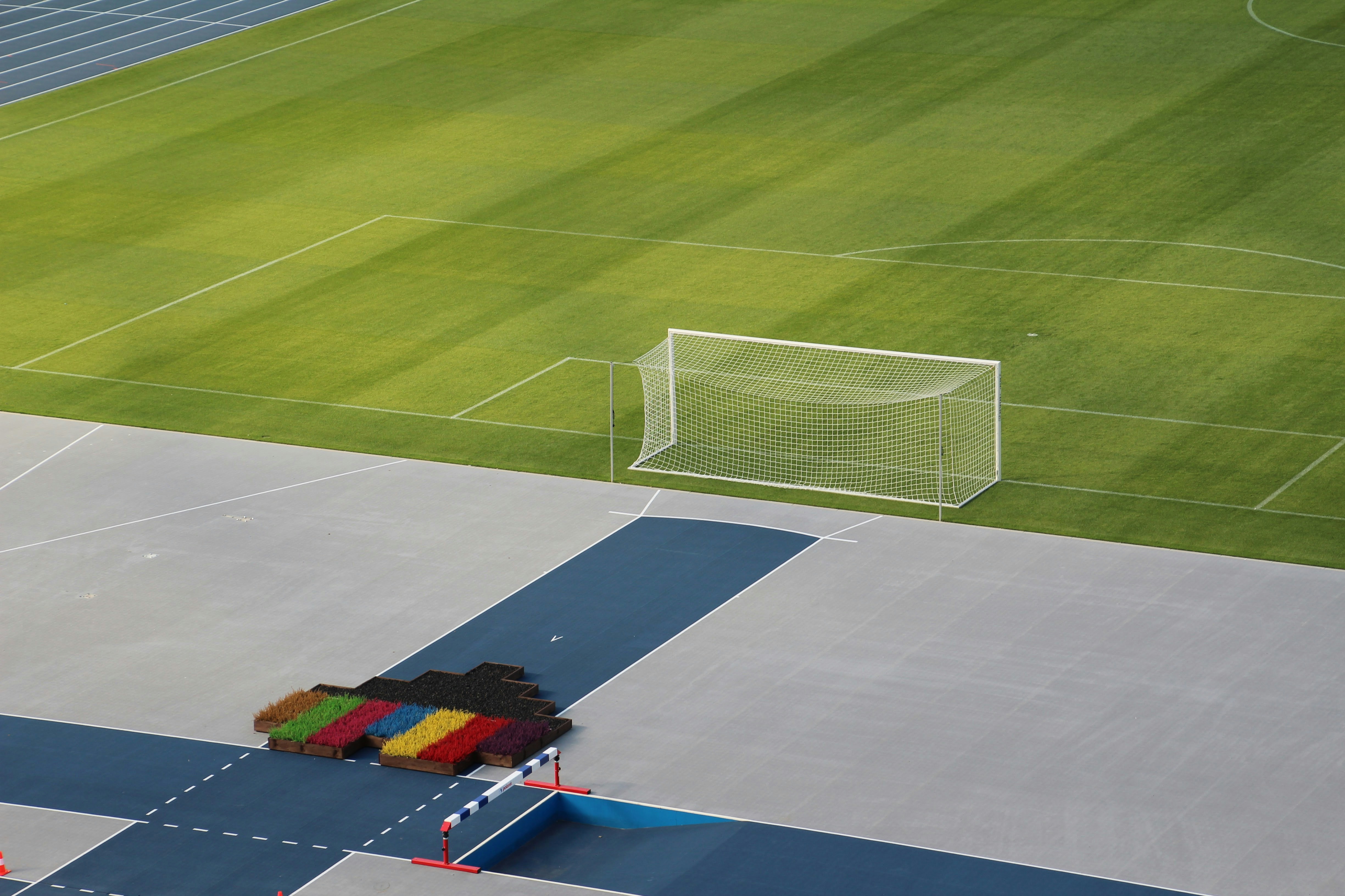 Empty soccer field with goal and track