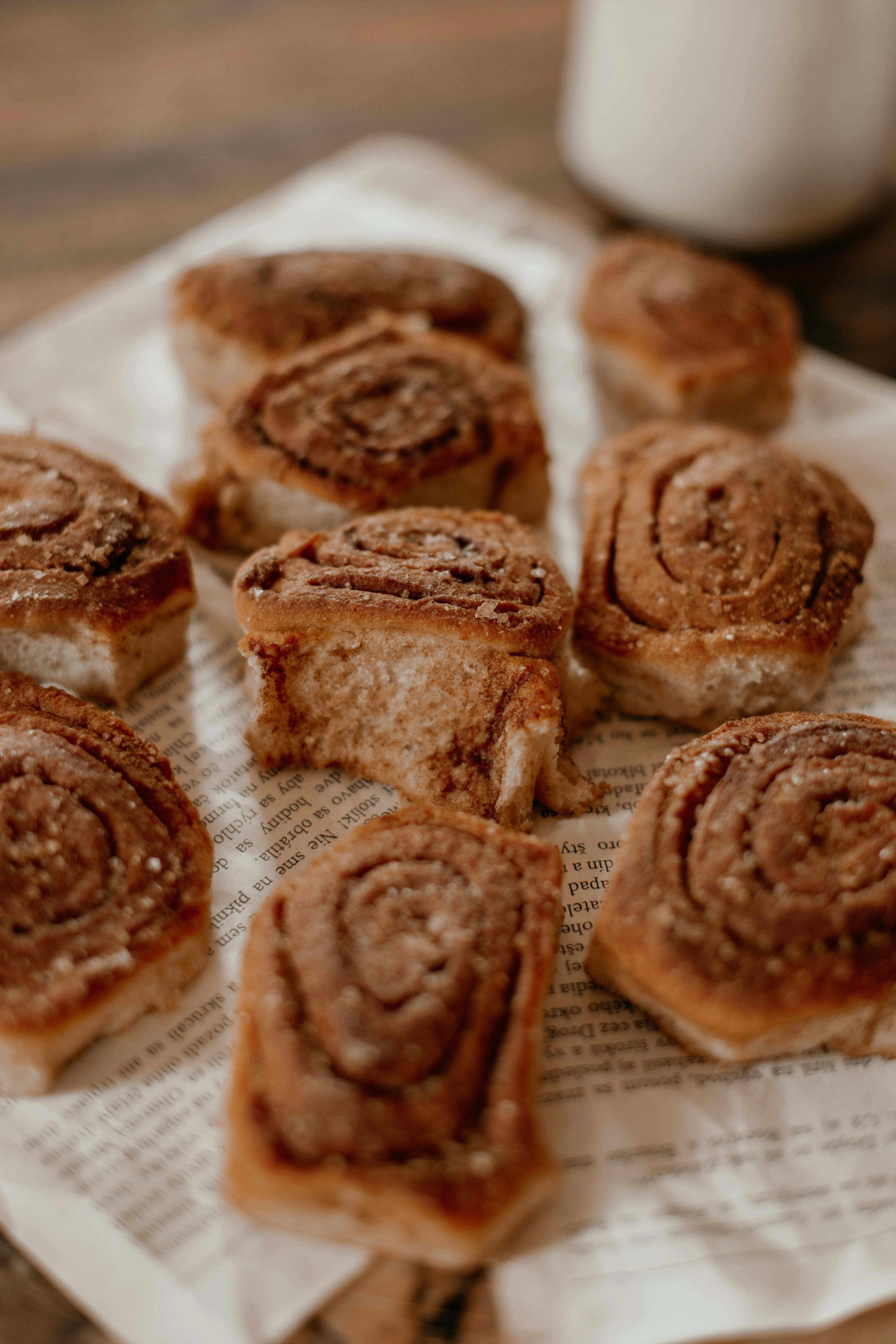 Freshly baked cinnamon rolls on a newspaper