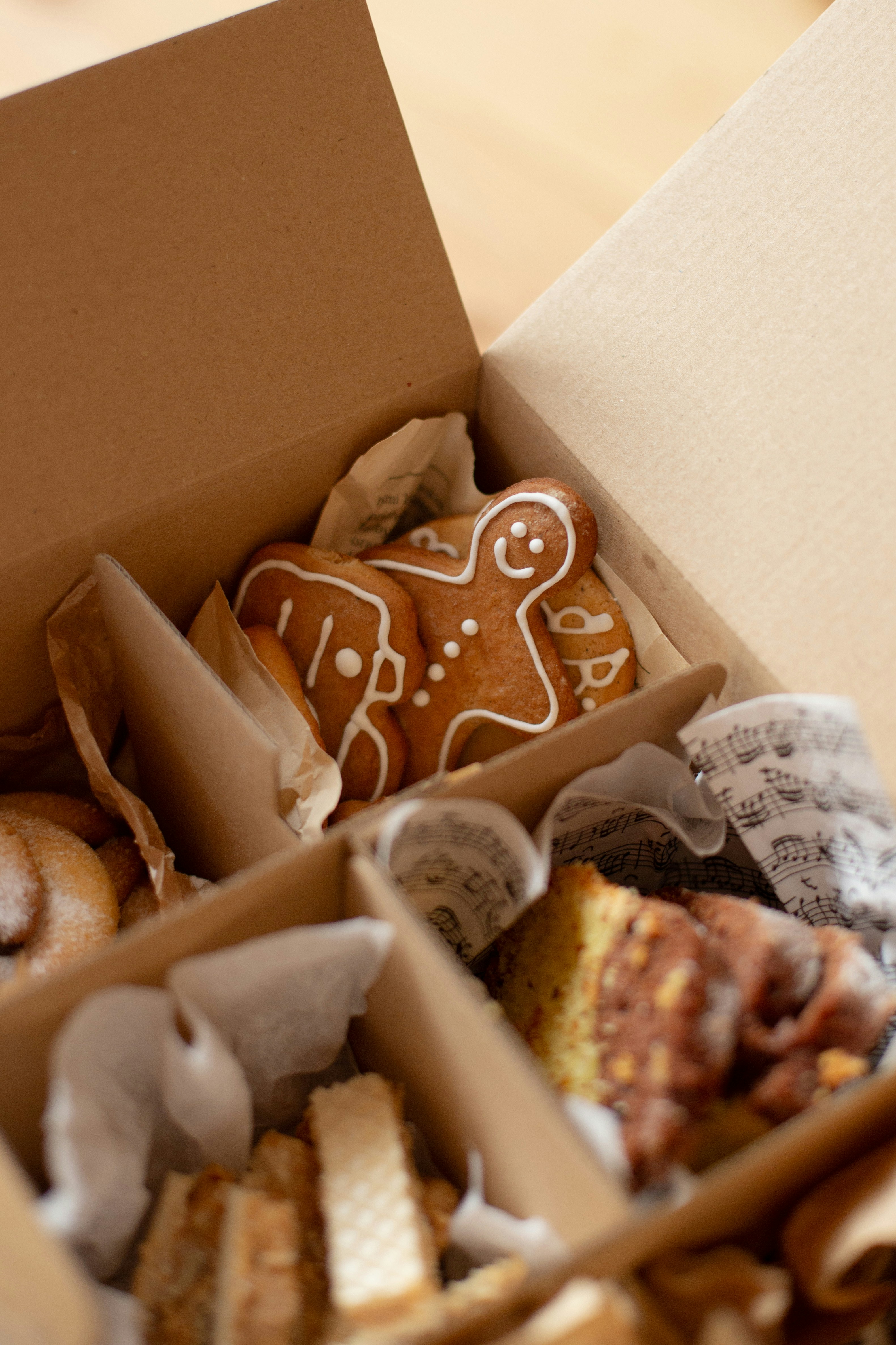 Gingerbread cookies and assorted treats in a box