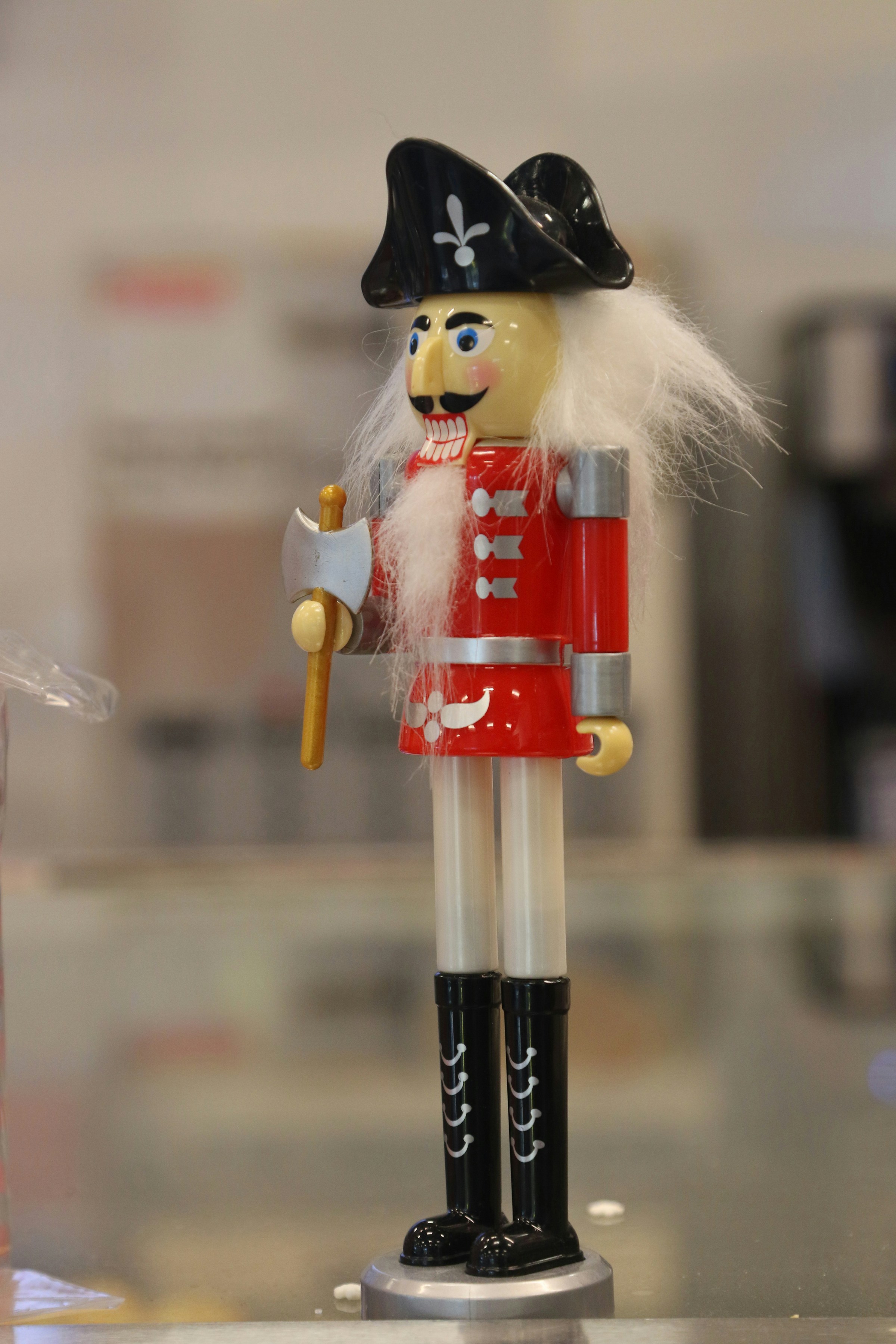 A nutcracker dressed as a soldier with an axe.