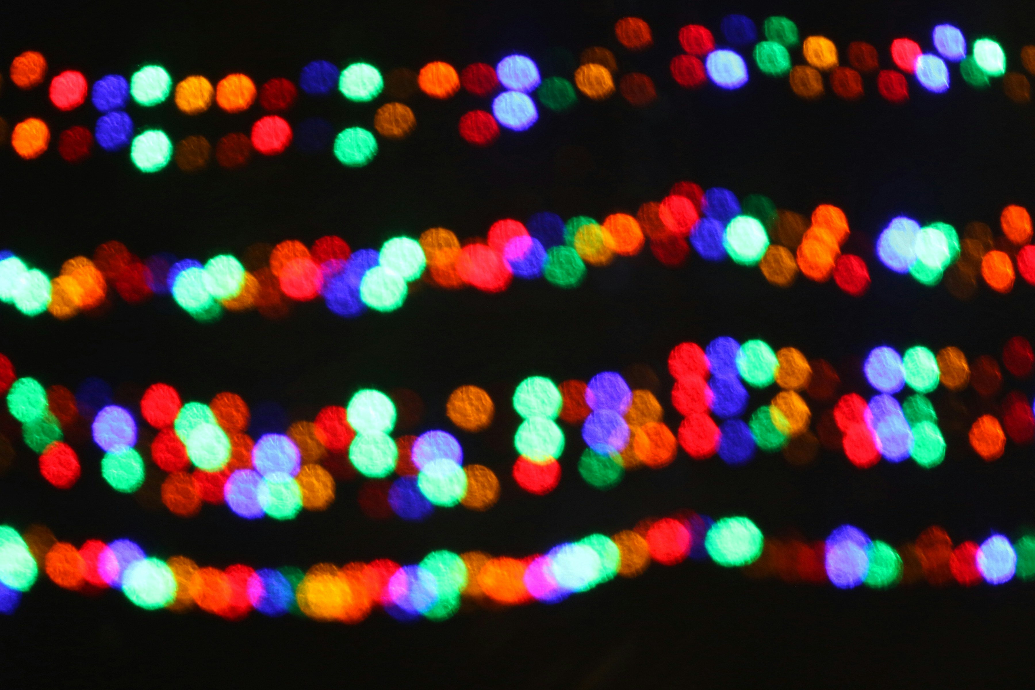 Out of focus colorful lights on dark background