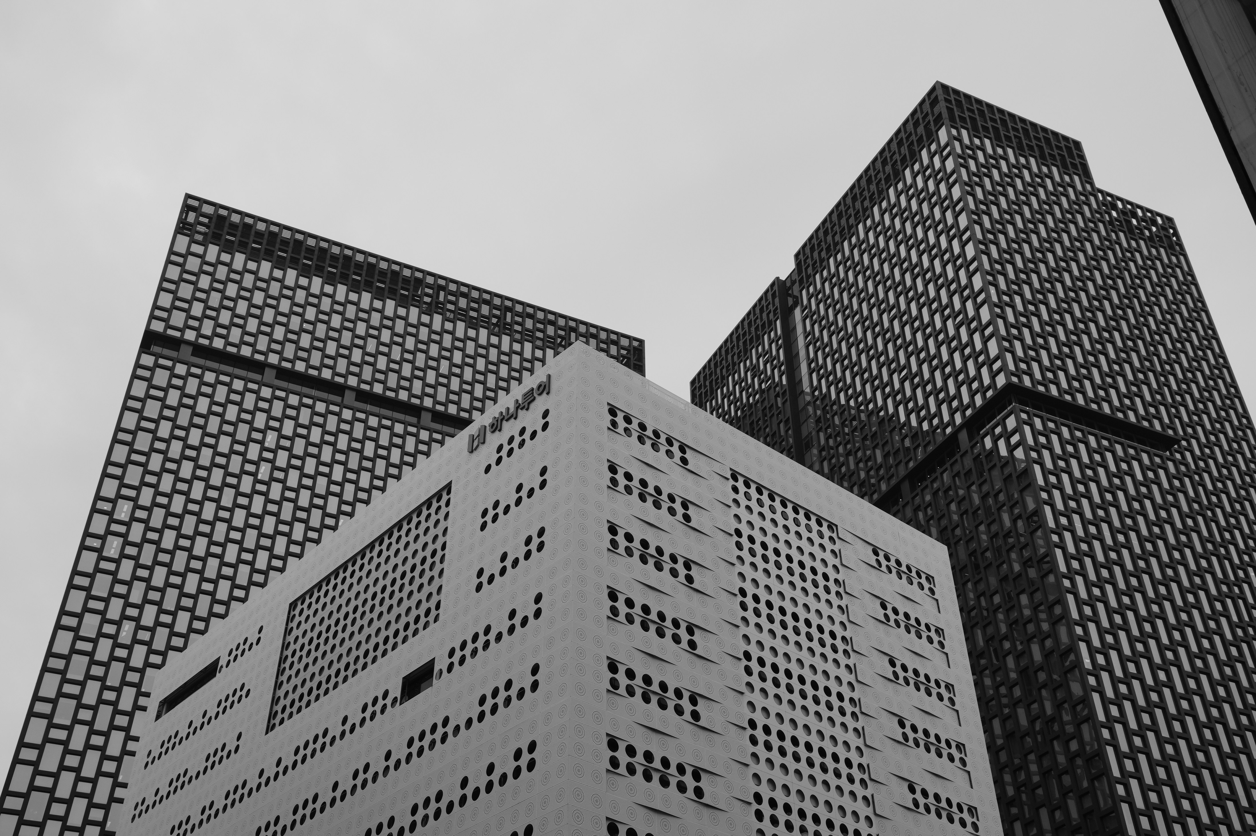 Modern skyscrapers with geometric patterns against sky