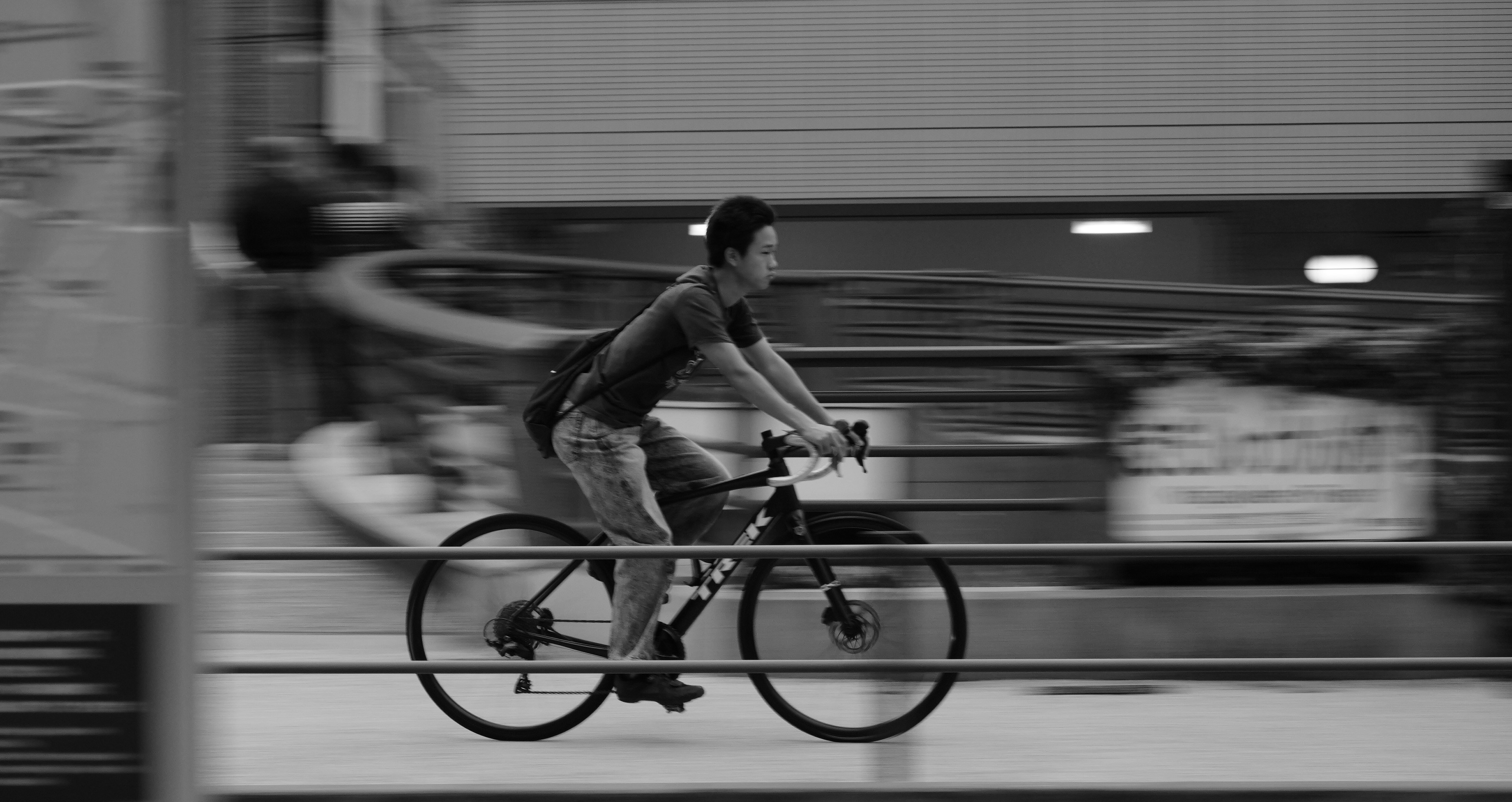 Man riding a bicycle with motion blur