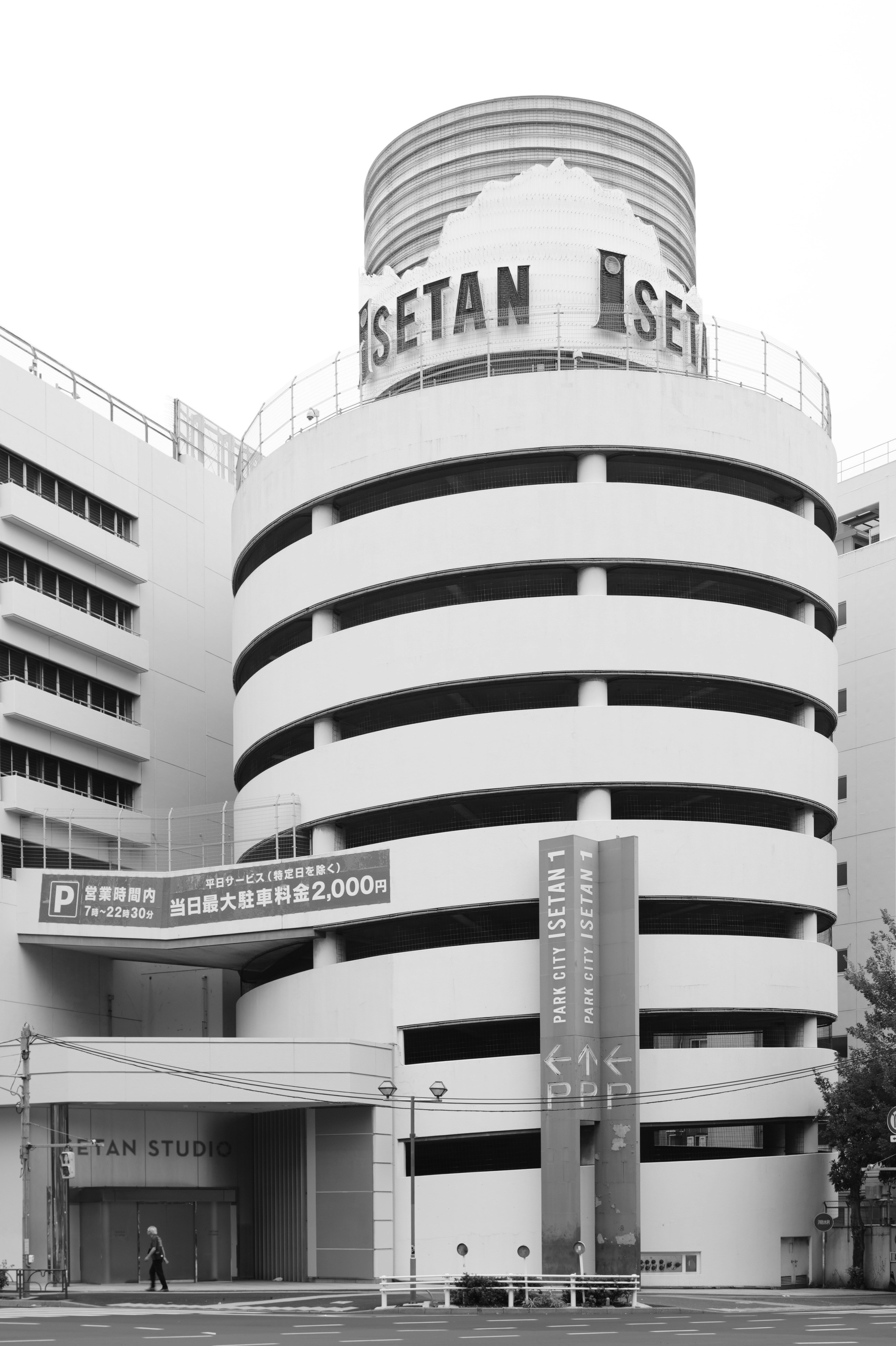 Modernist building with circular parking garage levels.
